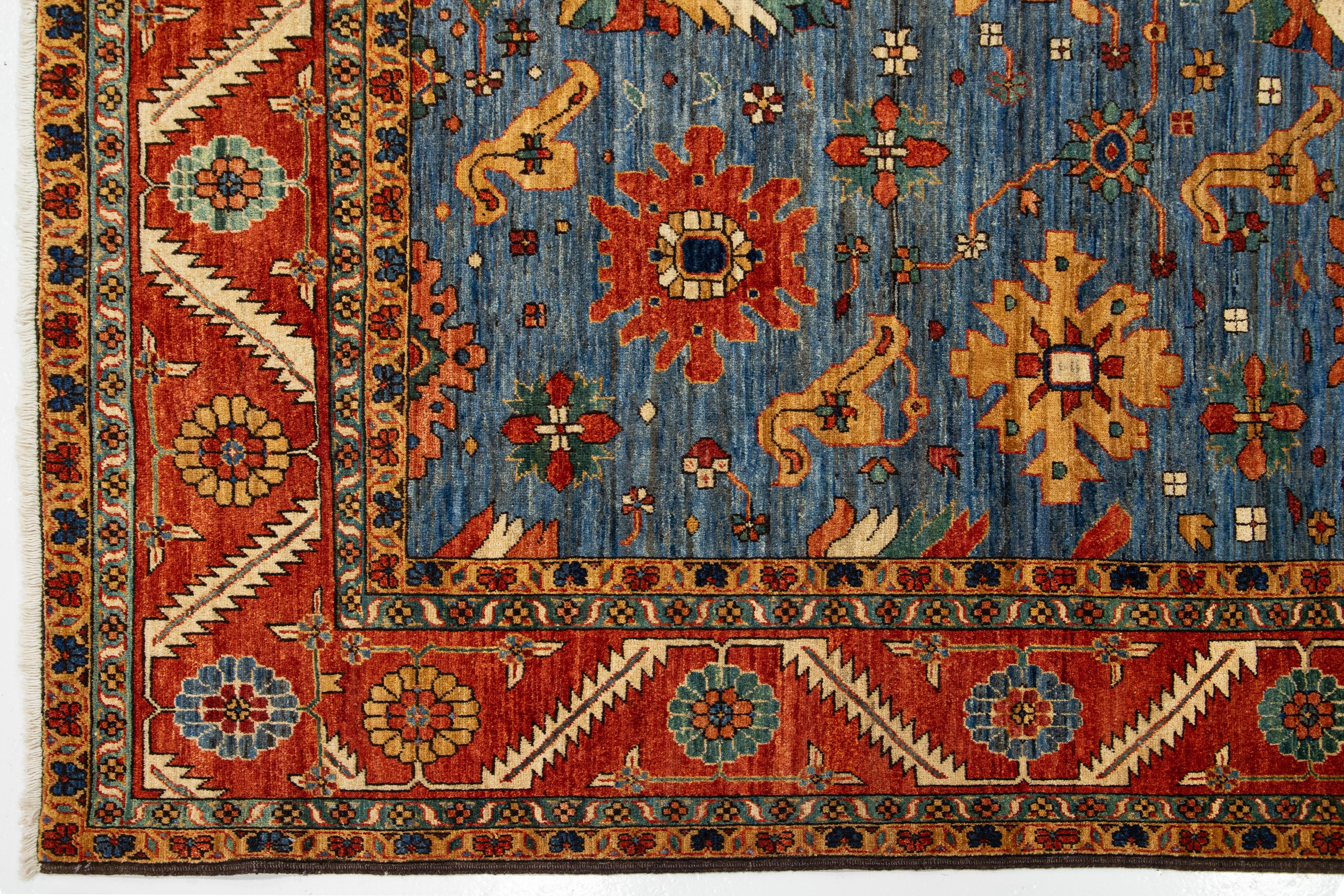 Pakistani 8 x 14 Contemporary Serapi-Style Blue Wool Rug Featuring a Floral Design For Sale
