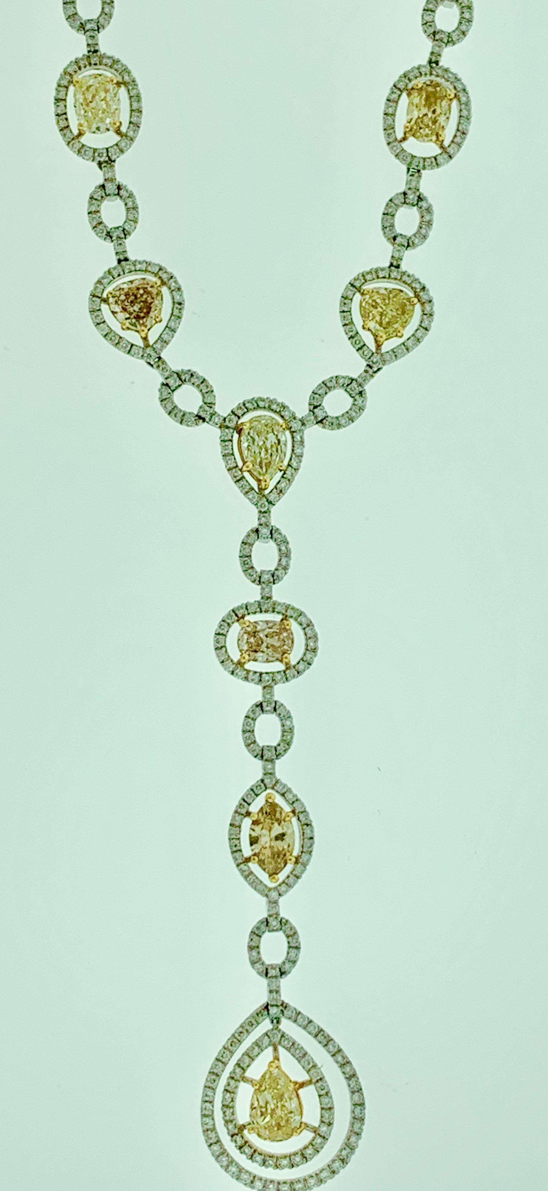This is one of the premium necklaces in our Bridal collection that is sure to impress. It features 8 solitaire pieces of yellow diamonds that weigh approximately 10 carats, all mounted in 18 karat gold. The yellow diamonds come in different shapes