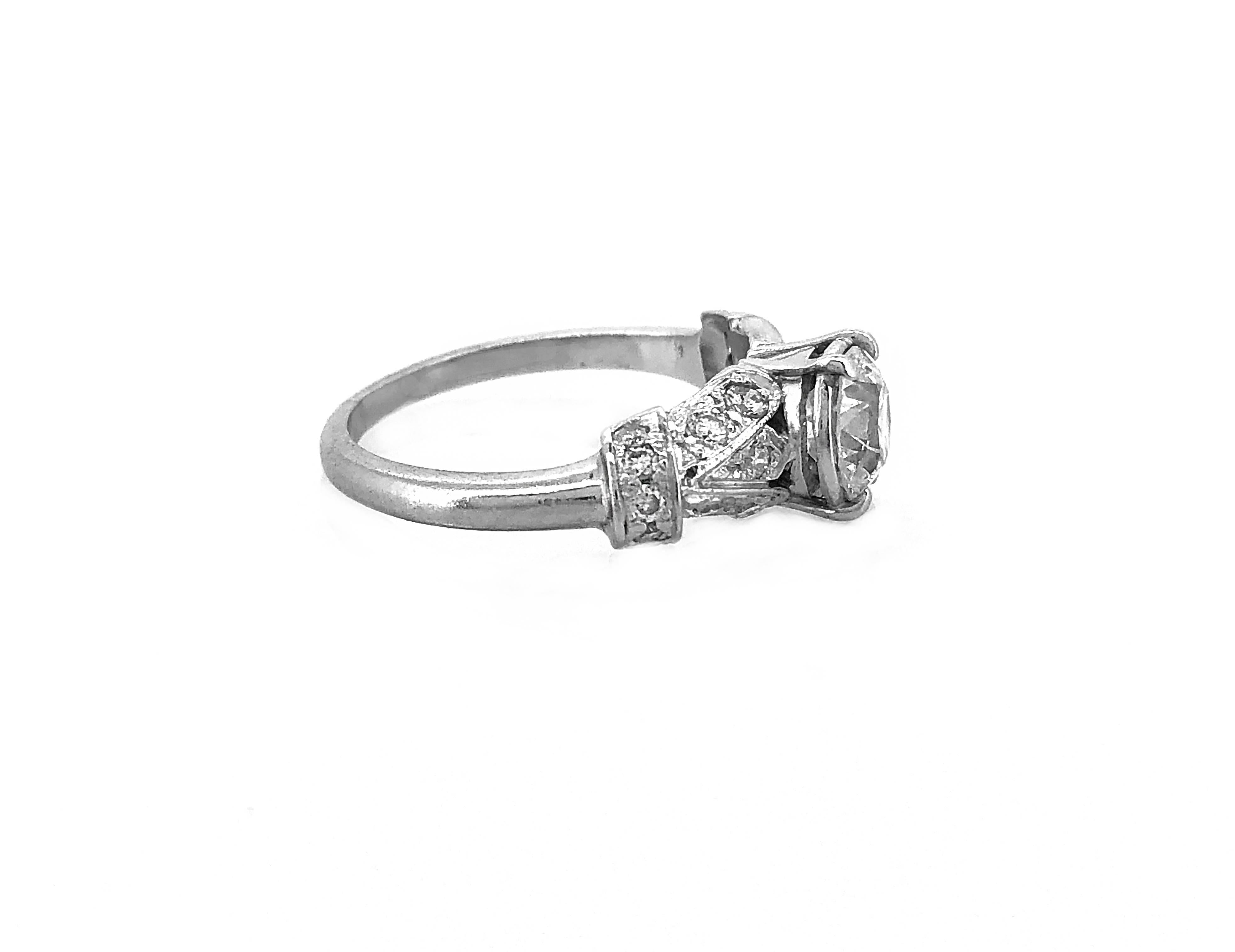 Here is a fabulous Art Deco diamond Antique engagement ring that features a .80ct. apx. Transitional cut diamond with wonderful VS2 clarity and G color. This decorative mounting also features .50ct. apx. T.W. of transitional cut diamonds with VS-SI