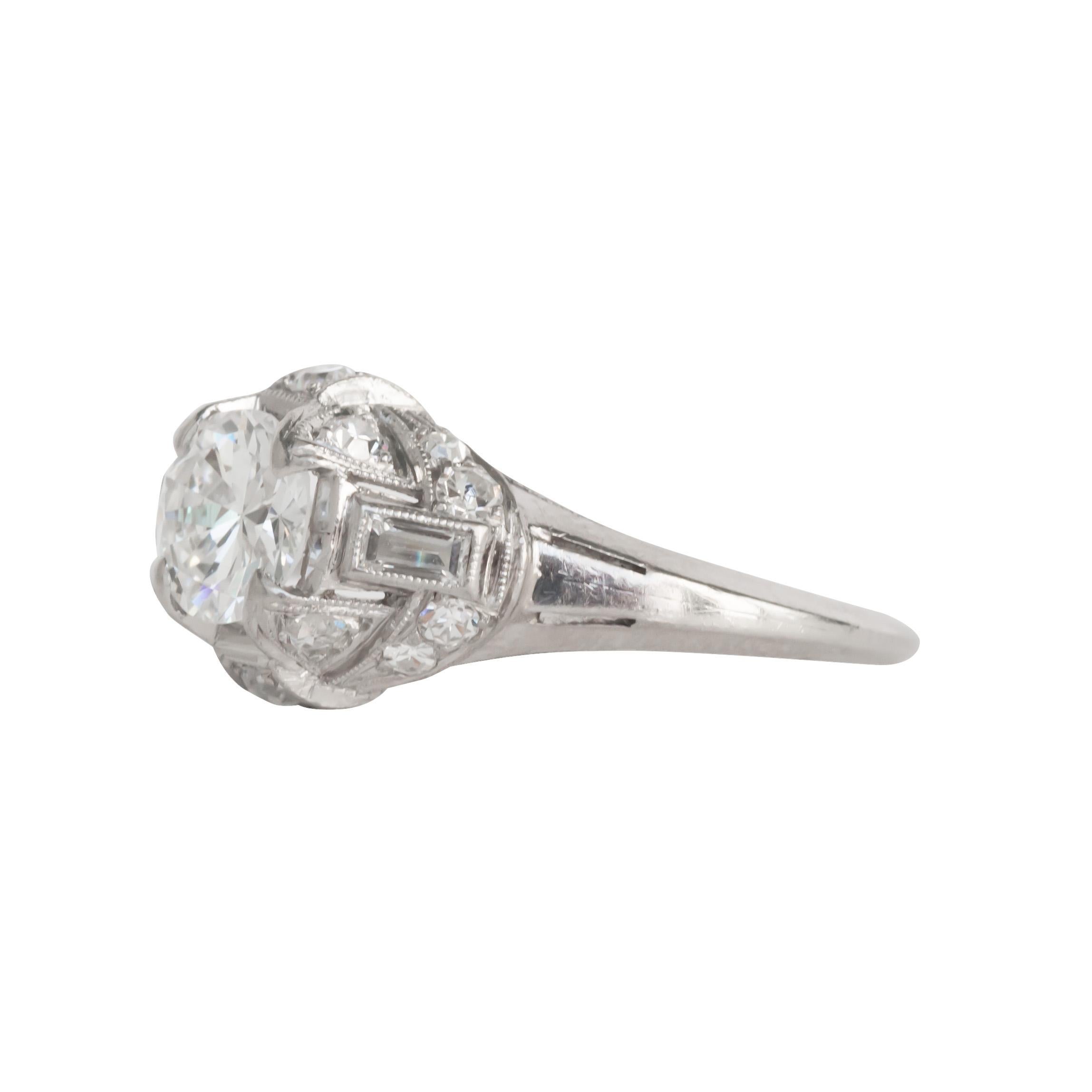 Ring Size: 6.75
Metal Type: Platinum [Hallmarked, and Tested]
Weight: 3.8  grams

Center Diamond Details:
Weight: .80 carat
Cut: Transitional European Cut
Color: E-F
Clarity: SI1

Side Diamond Details:
Weight: .15 carat, total weight
Cut: Antique