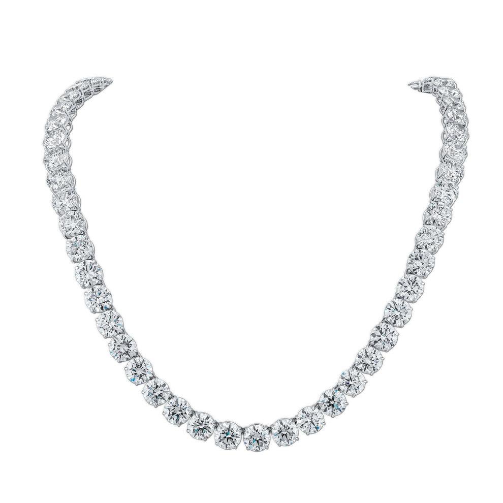 This 80-carat diamond tennis necklace is an extraordinary display of brilliance, elegance, and craftsmanship. Featuring 1.25-carat round brilliant-cut diamonds, each meticulously selected for VS clarity, this masterpiece offers breathtaking sparkle