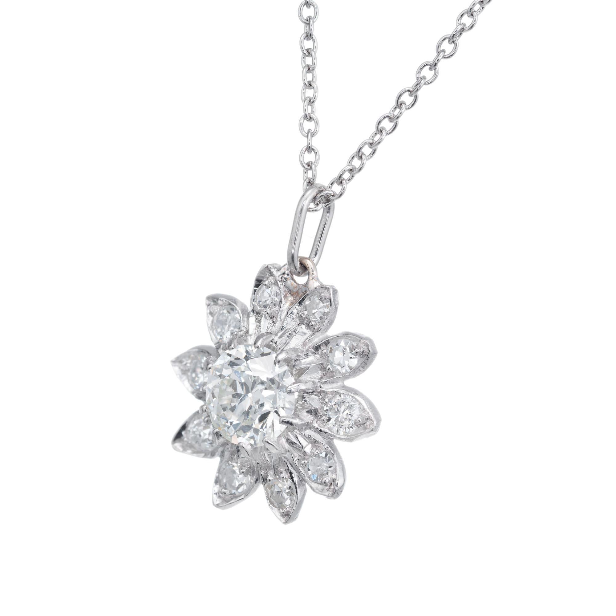 Art Deco Old European cut diamond flower pendant necklace in 14k white gold with an 18inch white gold chain. 

1 Old European cur diamond I, SI approx. .50cts
10 single cut diamonds I, VS-SI approx. .30cts
14k white gold 
Tested: 14k
4.0 grams
Top