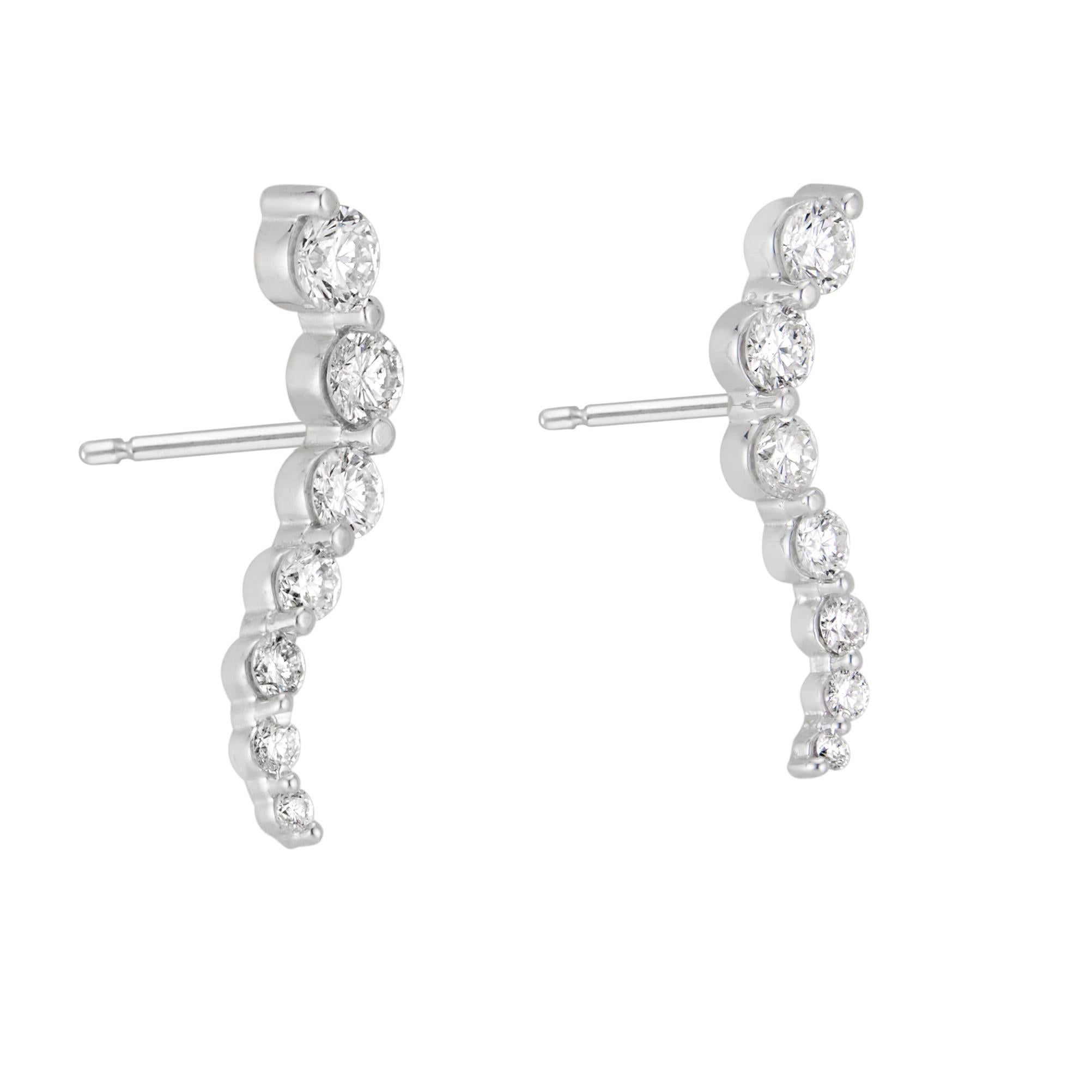 Journey style 14k white gold earrings. 14 round brilliant cut diamonds, .80 total carats. 

14 round brilliant cut diamonds, G-H VS-SI approx. .80cts
14k white gold 
Stamped: 585
2.2 grams
Top to bottom: 20.6mm or .81 inches
Width: 5.4mm or 1/5