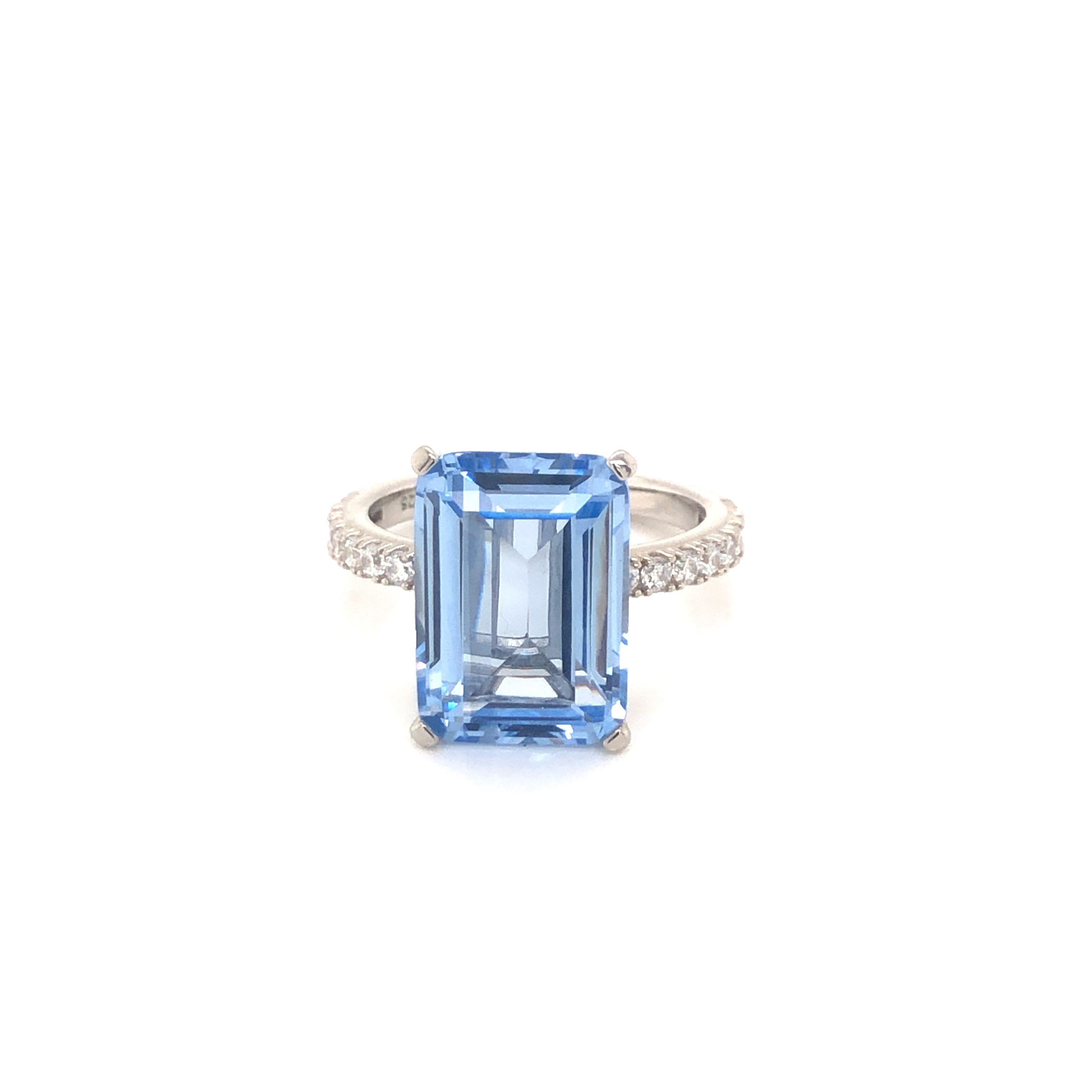 Striking ocean blue tones radiate from this stunning statement piece. 

Featuring a large 8.00ct light blue spinel emerald cut, with 0.32ct of round brilliant cuts on the shoulders, set in platinum on 925 sterling silver.

Whether you're looking for