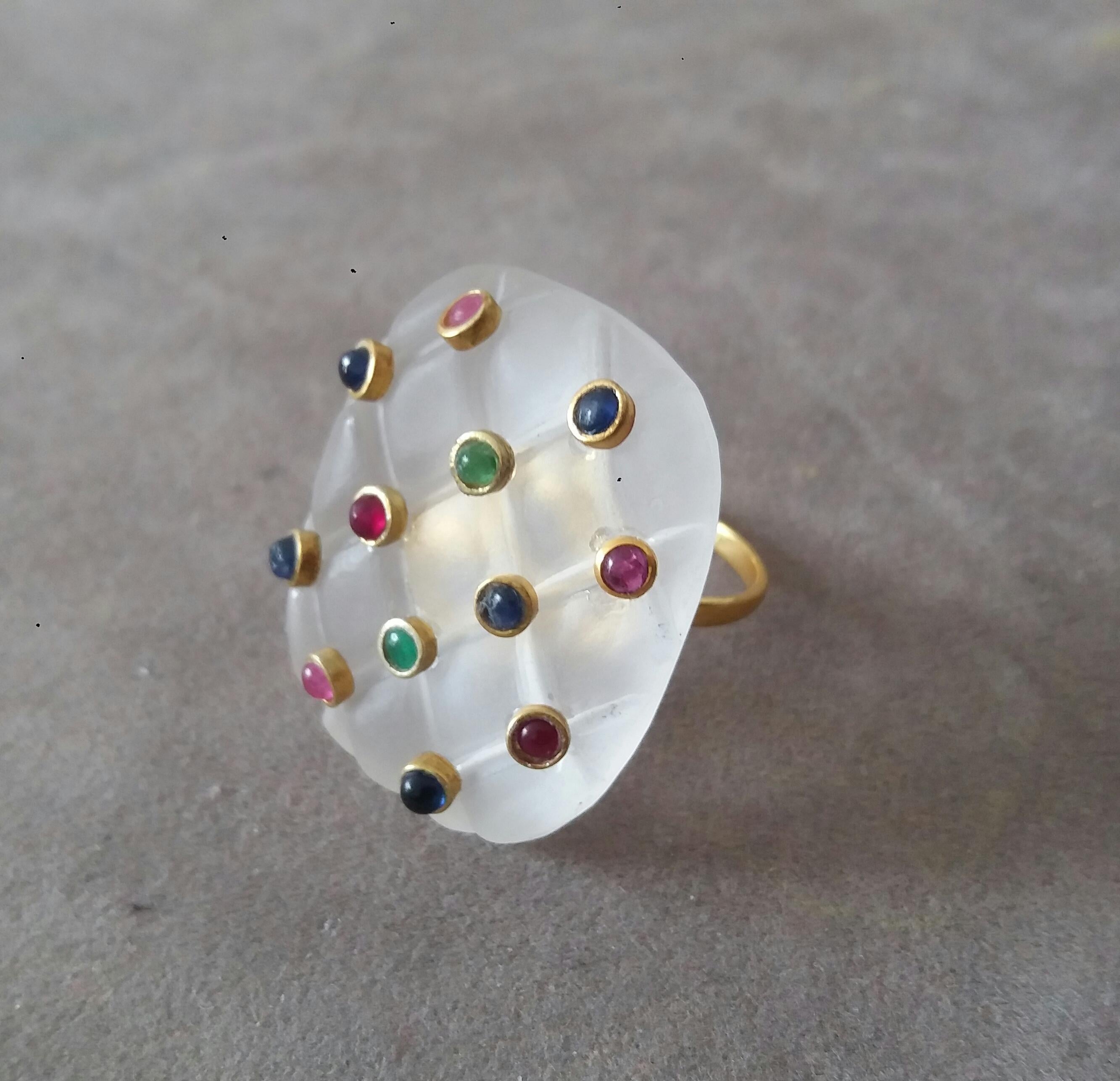 Extremely Stylish and Unique Ring composed by a Natural Cushion Shape Quartz  measuring 27 x 34 mm and weighing 80 Carats, decorated with 12 small round Rubies, Emeralds and Blue Sapphires set in 14K yellow small gold bezels.

In 1978 our workshop
