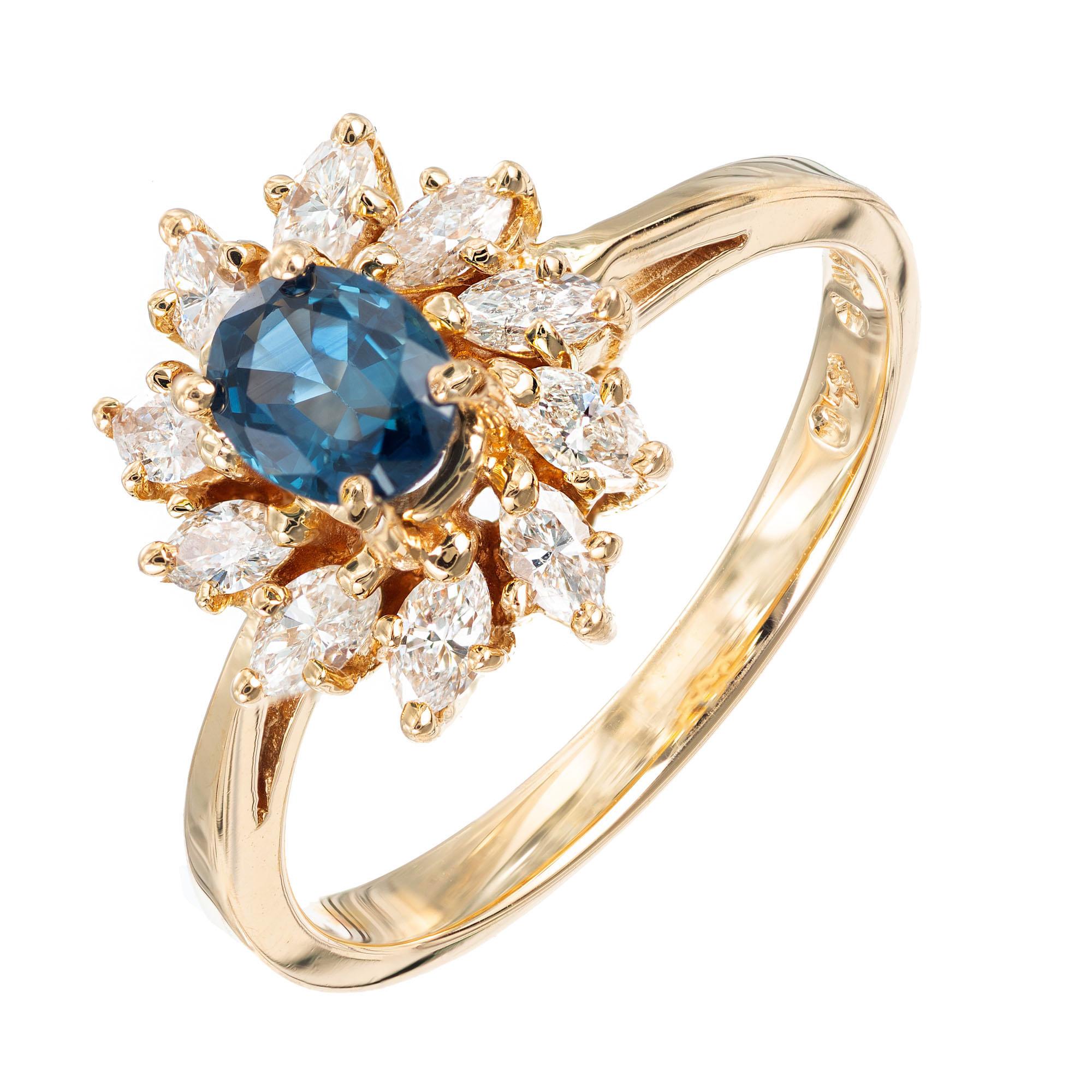 Sapphire and diamond engagement ring. .35cts oval center sapphire with a halo of 10 marquise diamonds in a 14k yellow gold setting. 

1 oval blue sapphire, SI approx. .35cts
10 marquise diamonds, G VS-SI approx. .80cts
Size: 6.25 and sizable 
14k