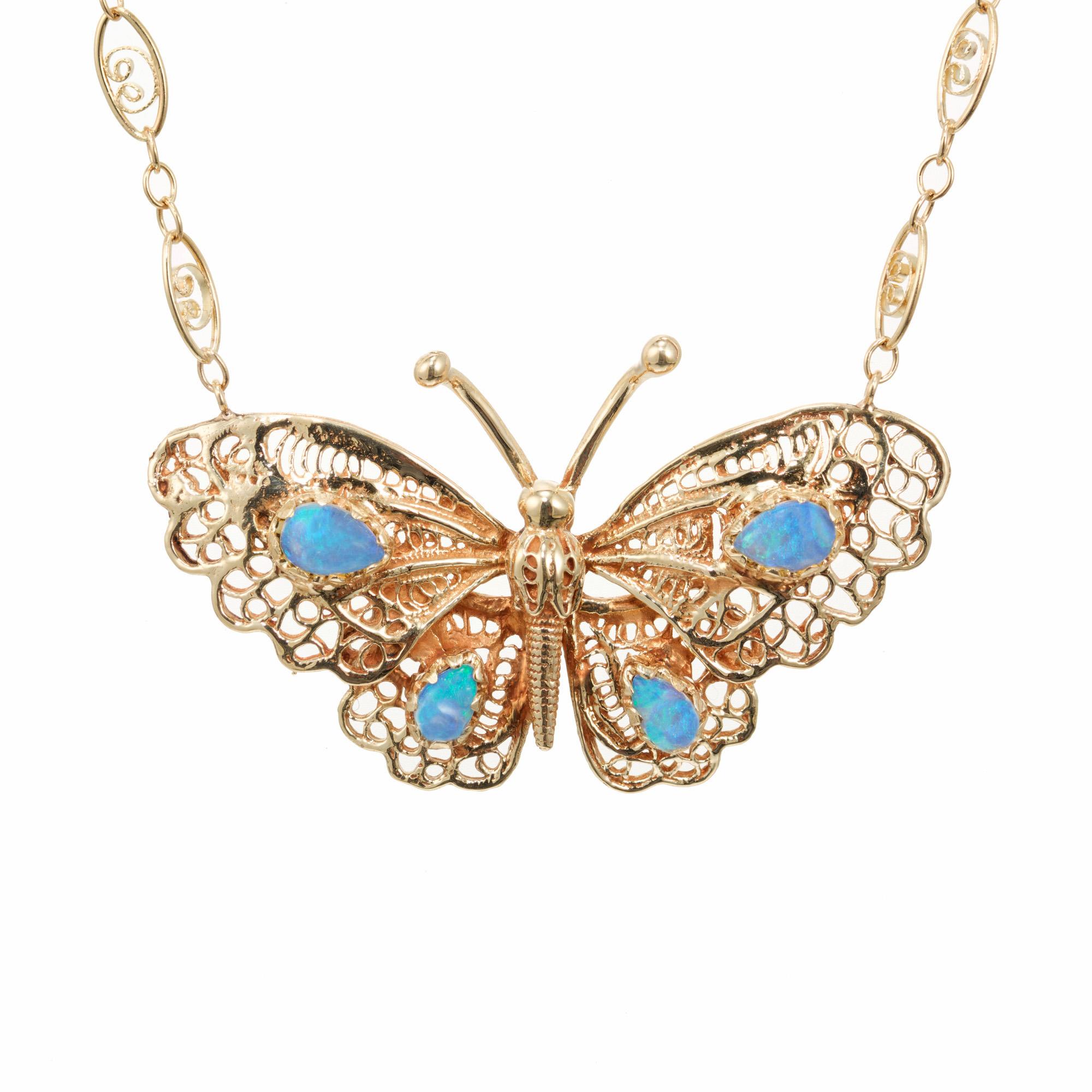 1950's mid-century Filagree opal pendant necklace. 4 pear shaped cabochon greenish/blue opals set in a 14k yellow gold filigree butterfly setting with at  19.5 inch 14k yellow gold chain. Superb example of the 1950's craftsmanship. 

4 pear shaped