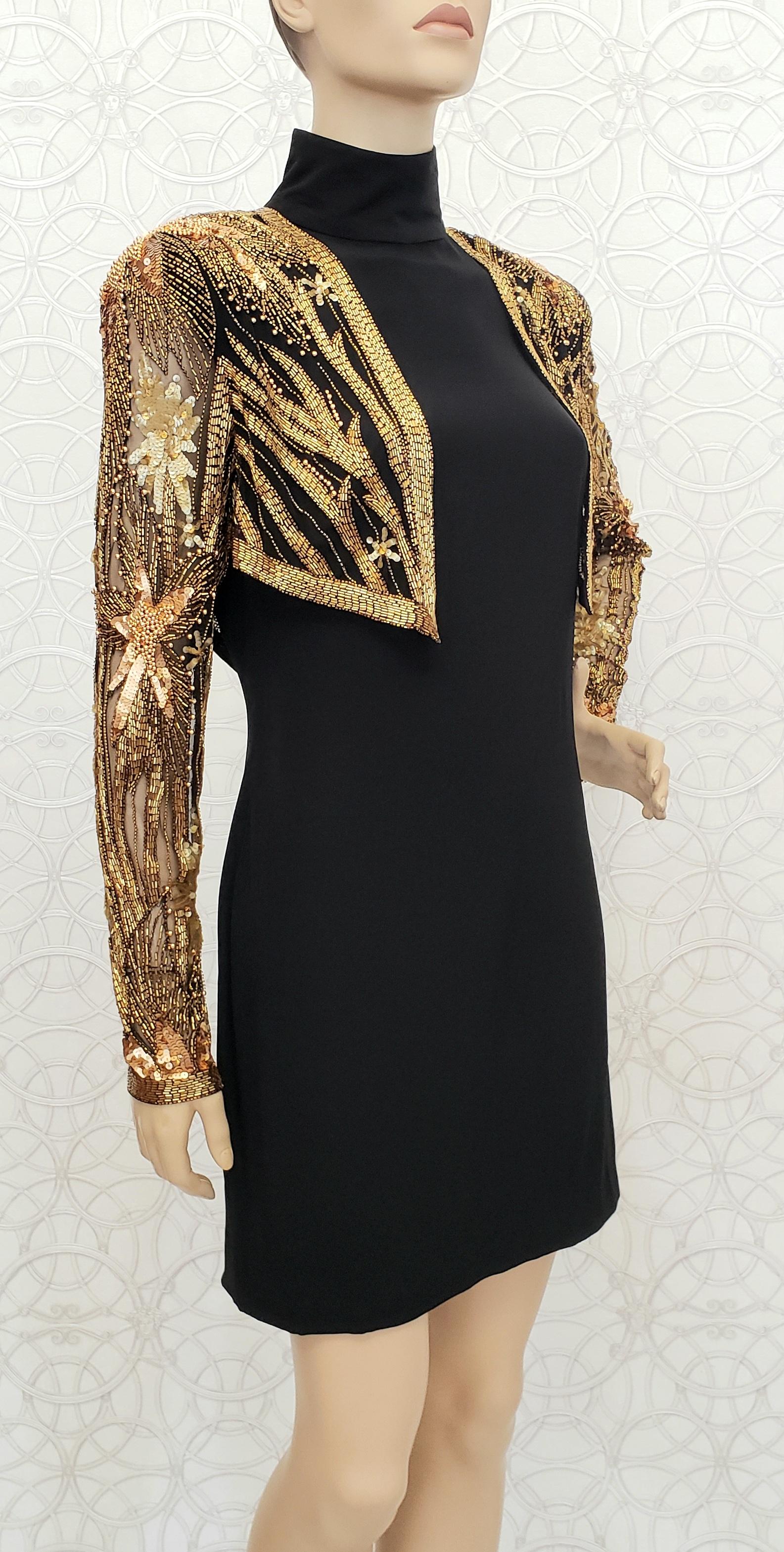 80-s Bob Mackie Beaded Bolero Dress

Beaded with sequins and glass beads. 
Turtleneck, zippers on the sleeves
Back zipper

Color: Black/Gold

Content: 
Bodice: 100% Nylon
Bottom : 66% Acetate, 34% Rayon

Size US 10

Shoulder to shoulder 17