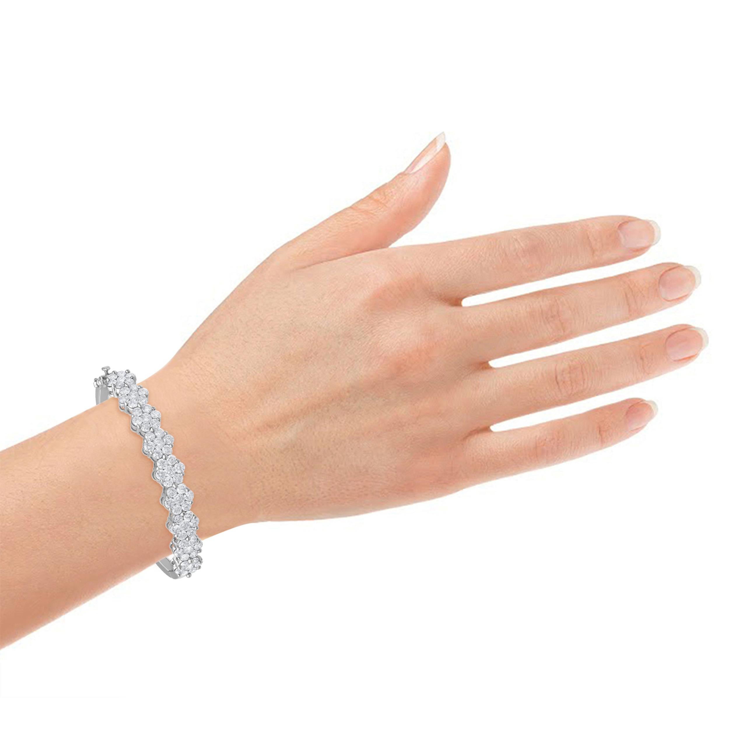 Nine Flower Designs studded with a total of 8.00 cats diamonds placed in prongs setting with each flower look 0.88cts 6 stone, along with a wonderful 9 diamond flower bangle design! This bangle will adorn your pretty wrist along with and get them