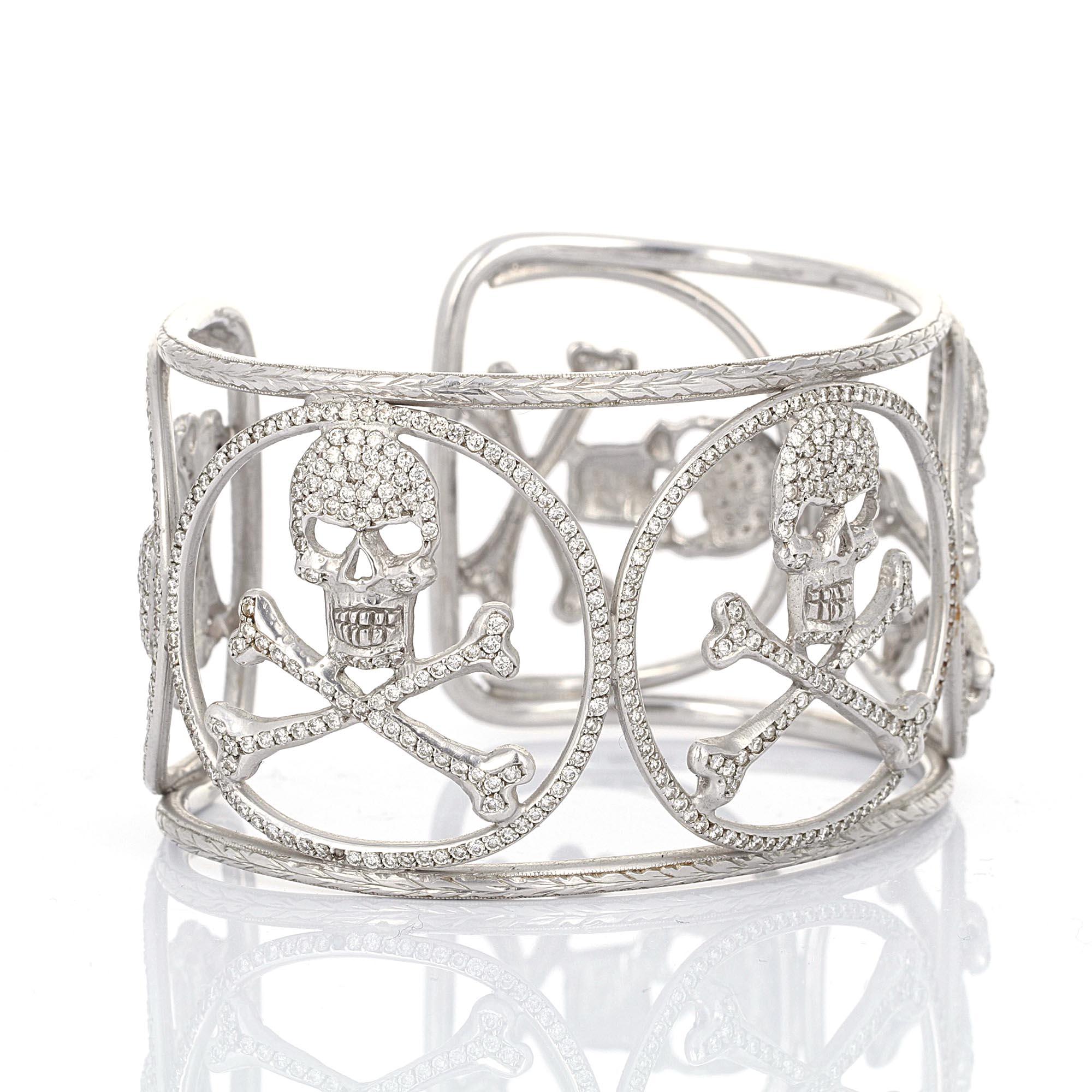 Loree Rodkin, 18 karat white gold 8 carat diamond skull cuff . There are 778 round brilliant white diamonds weighing an estimated 8.00 carats total.  The diamonds average G-H, VS1-VS2.
The bangle cuff size is 6 1/2 inches. The diameter of the bangle