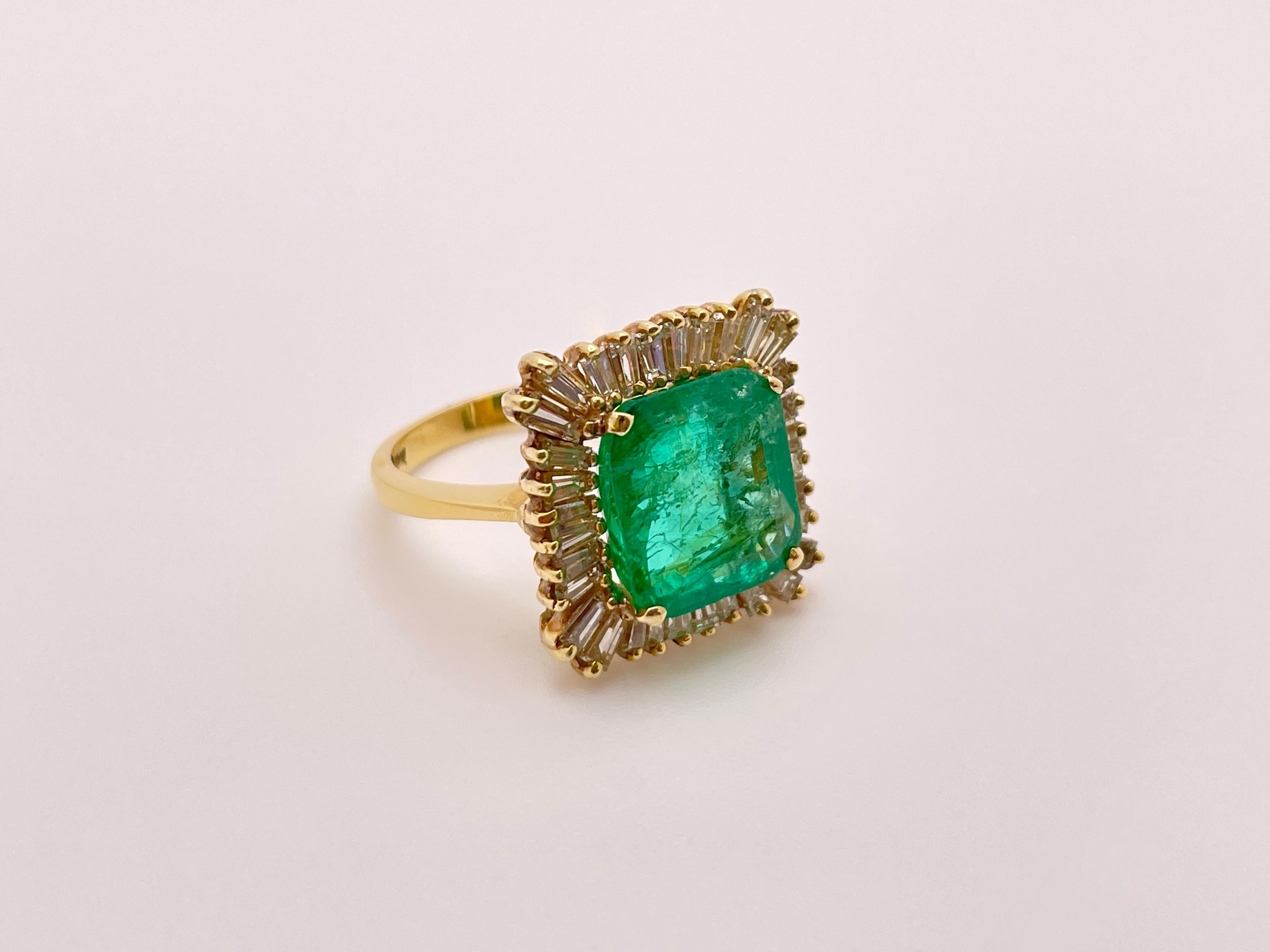 An extraordinary 18 K (karat) yellow gold emerald and diamond ring. Centered with a gorgeous square cut natural emerald with a stunning green color, weighing approximately 8.00 CT (carats) and measuring 11.02 x 11.03 x 6.05 mm. Surrounded by 32