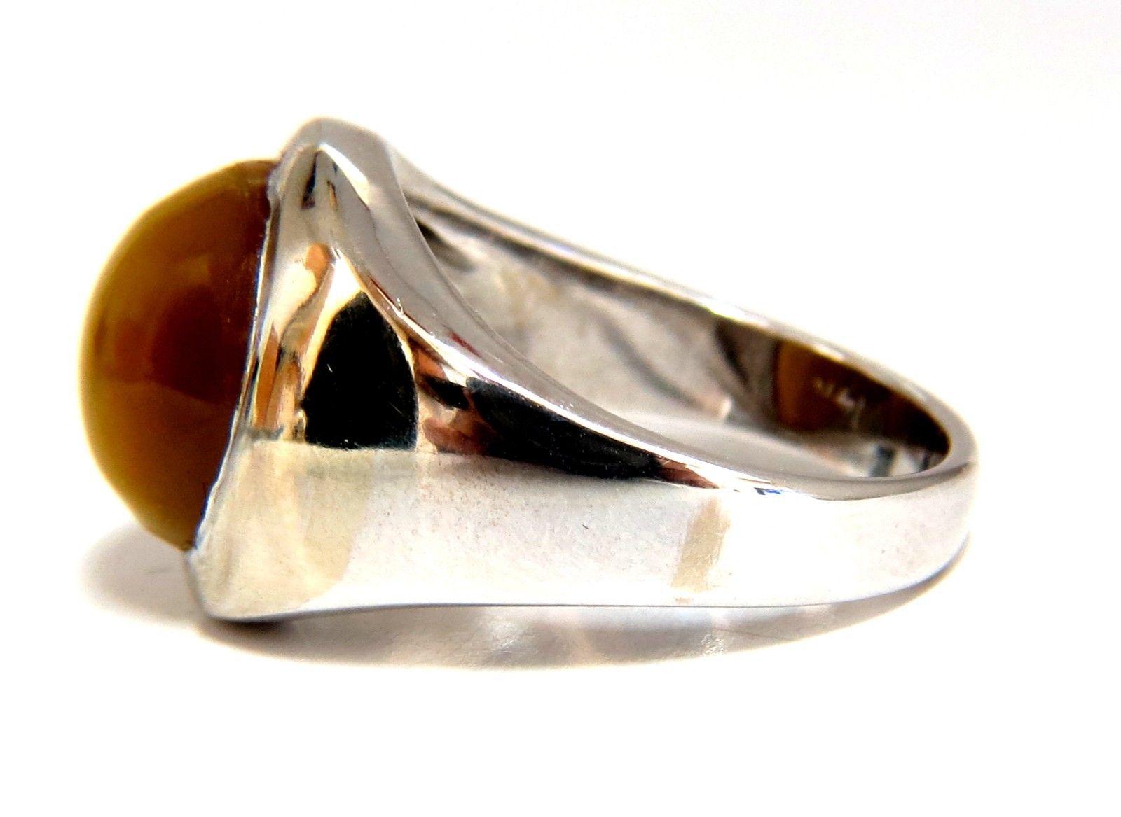 Mens Tiger Eye Pinky Addition

8ct. natural cabochon tiger eye ring

Full cut, Brilliant

12 x 11mm

14kt. white gold

8.8 grams

Ring Current size: 9

15.8mm wide

8.4mm depth