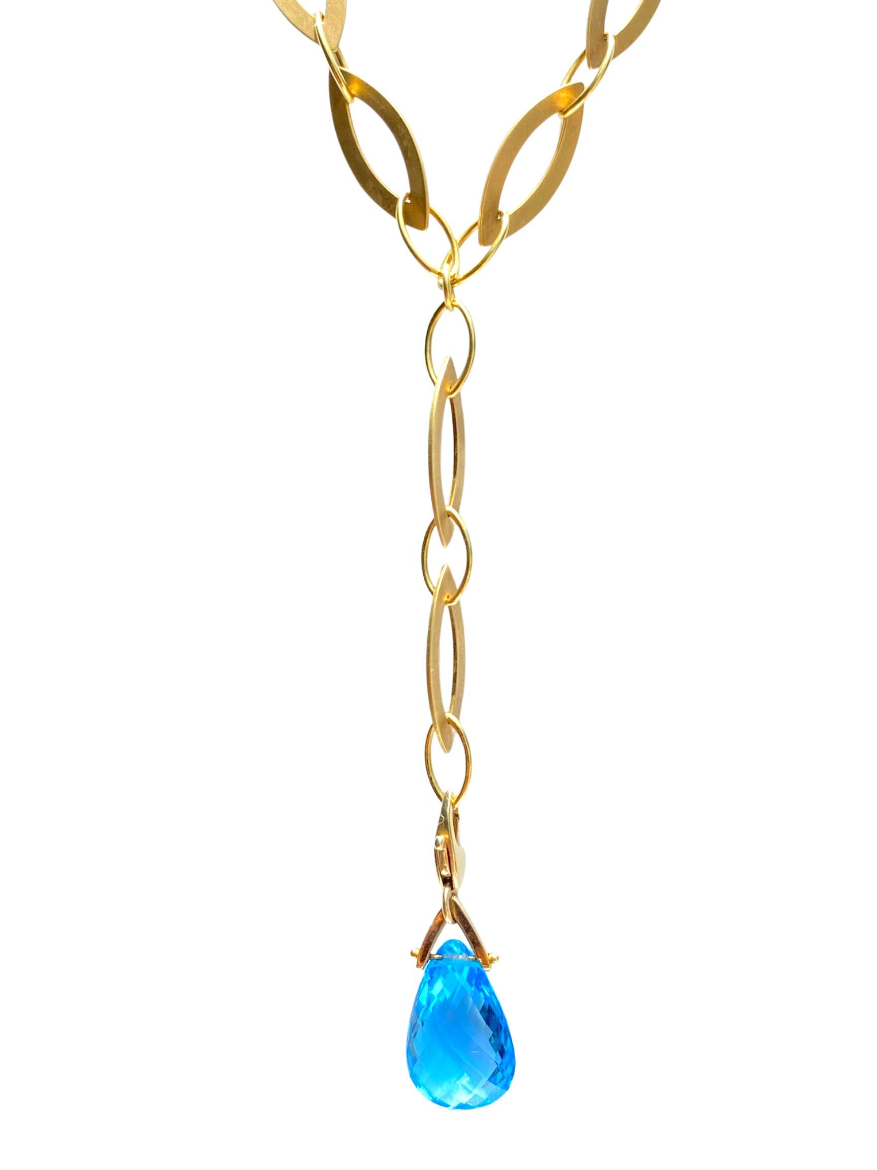 Centering an approximately ~8.00 Carat Pear-Shape Blue Topaz and set in 18K Yellow Gold, this minimalist-yet-intricate pendant necklace displays a vivid blue Topaz on a lush yellow gold backdrop.

Details:
✔ Stone: Blue Topaz
✔ Center-Stone Weight: