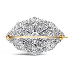 Broche ancienne en or bicolore de 8,00 carats, diamant taille ronde et saphir