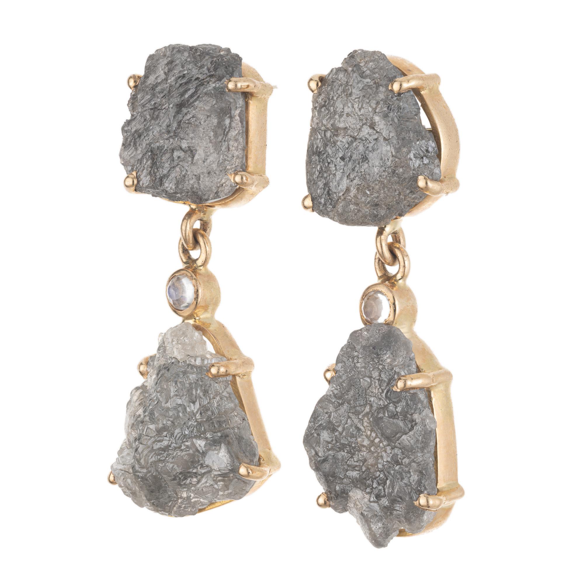 Rustic Salt and Pepper Yellow Gold Dangle Earrings. 8.00 carats of dazzling salt and pepper diamond slices that are accented by bezel set round moonstones. The captivating 18k yellow gold setting adds a warm and inviting touch to the overall design,