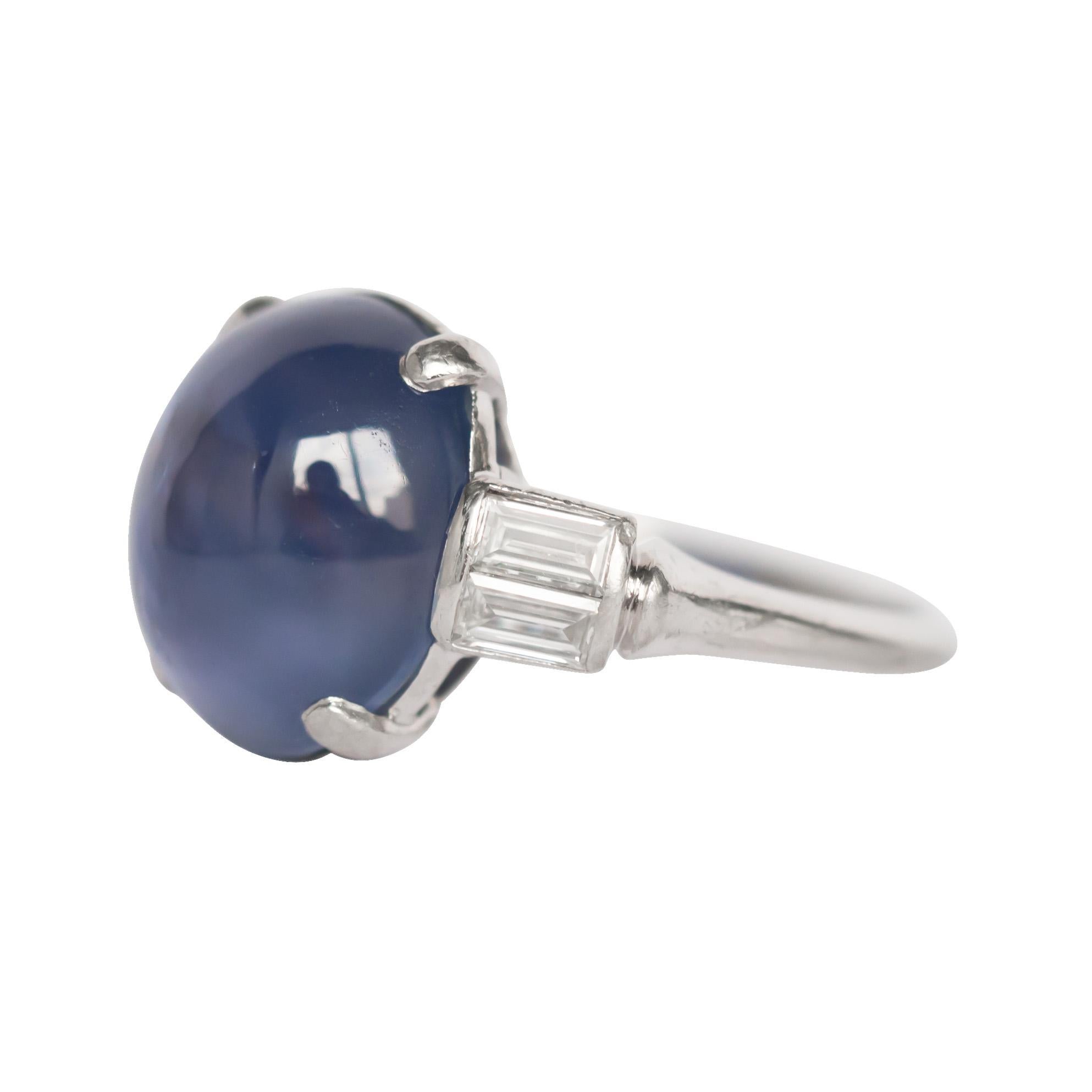 Ring Size: 4.95
Metal Type: Platinum
Weight: 6.3 grams

Color Stone Details: 
Type: Star Sapphire
Shape: Natural Unheated
Carat Weight: 8.00 carat

Side Stone Details: 
Shape: Antique Straight Baguette
Total Carat Weight: .40 carat, total