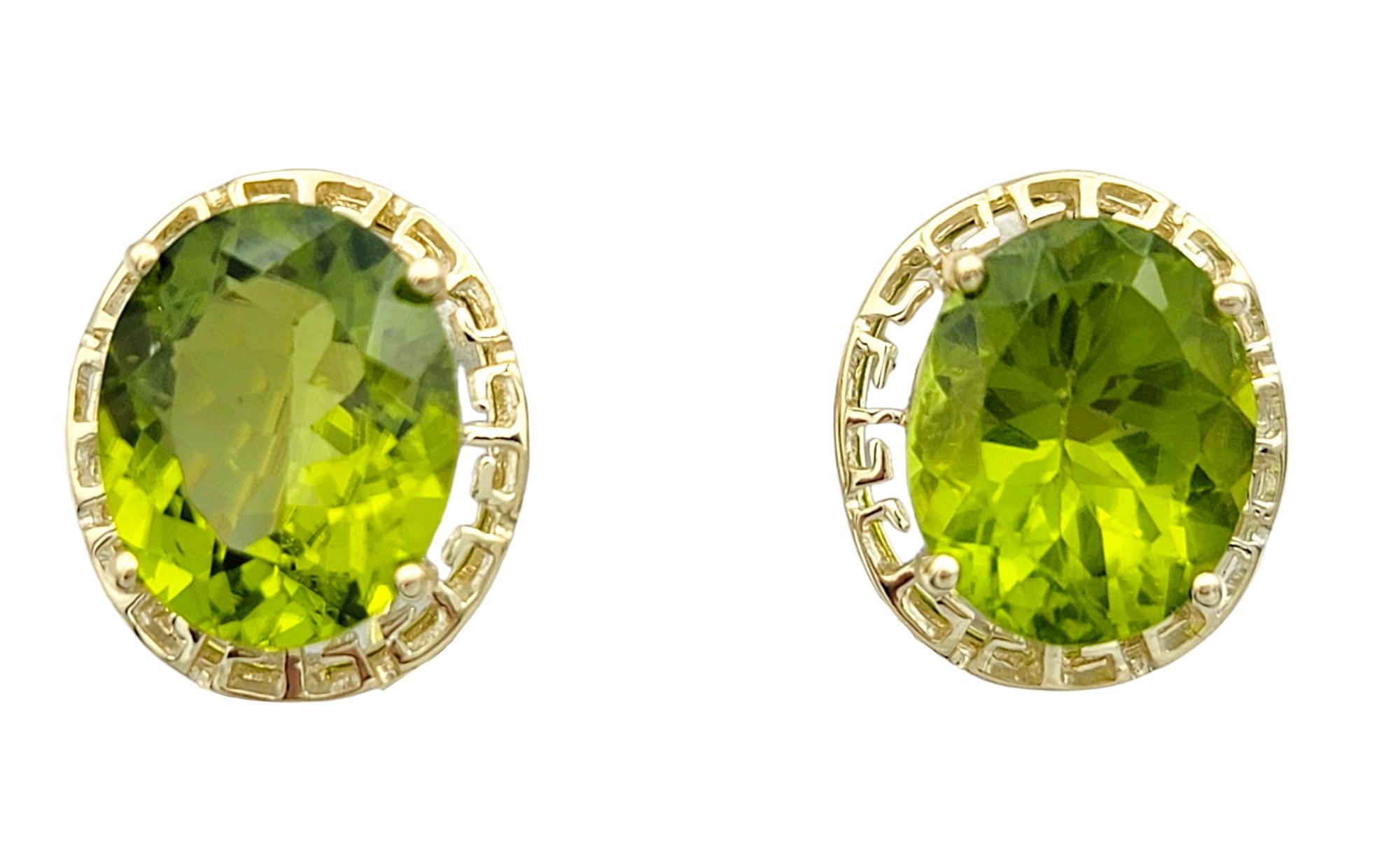 These oval green peridot earrings set in 14 karat yellow gold are a captivating blend of vibrant color and intricate design. Each earring features a stunning oval-cut peridot, radiating a lush green hue that draws the eye.

Encircling the peridots