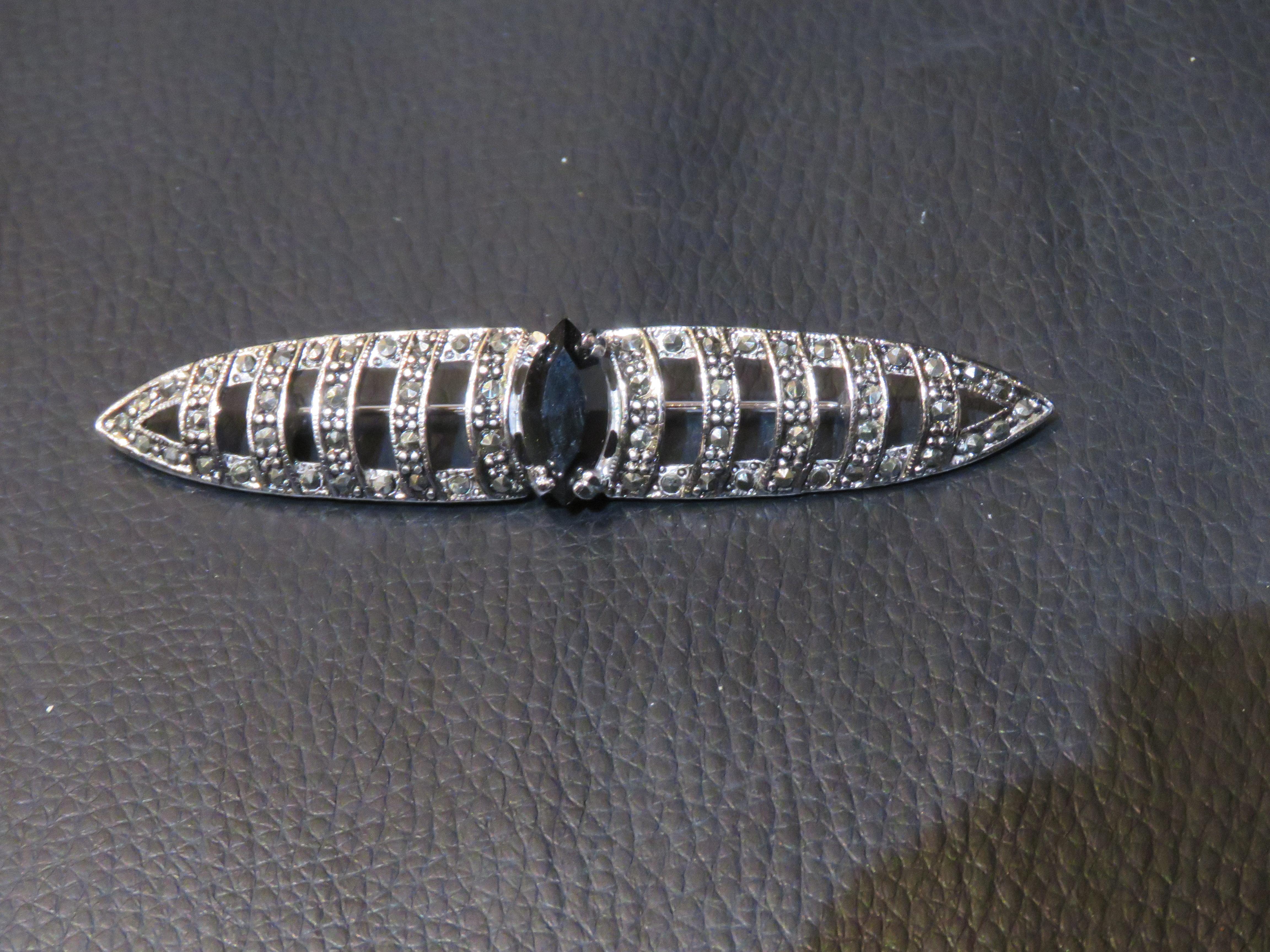 The Following Item we are offering are these Extremely Rare Beautiful 18KT Gold Overlay Fine Large Fancy Faceted Black Crystal Marcasite Art Deco Style Brooch Pin. Taken out of an Important New York Estate. Original Price $800.

Measures: 3 1/8 