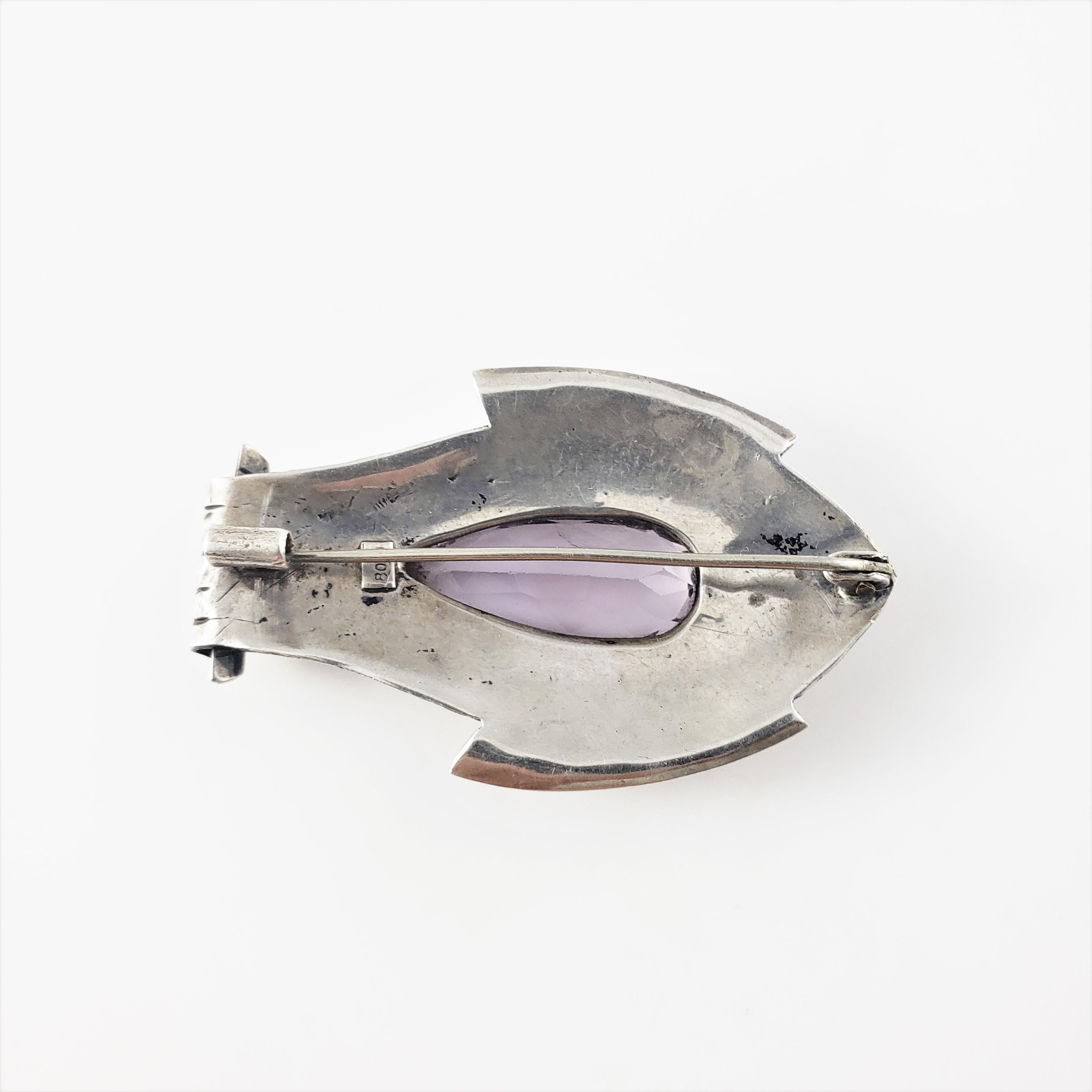 Vintage 800 Silver Fish Amethyst Pin/Pendant-

This lovely piece features a beautifully detailed fish decorated with a pear shaped amethyst stone (24 mm x 11 mm).

Size: 2