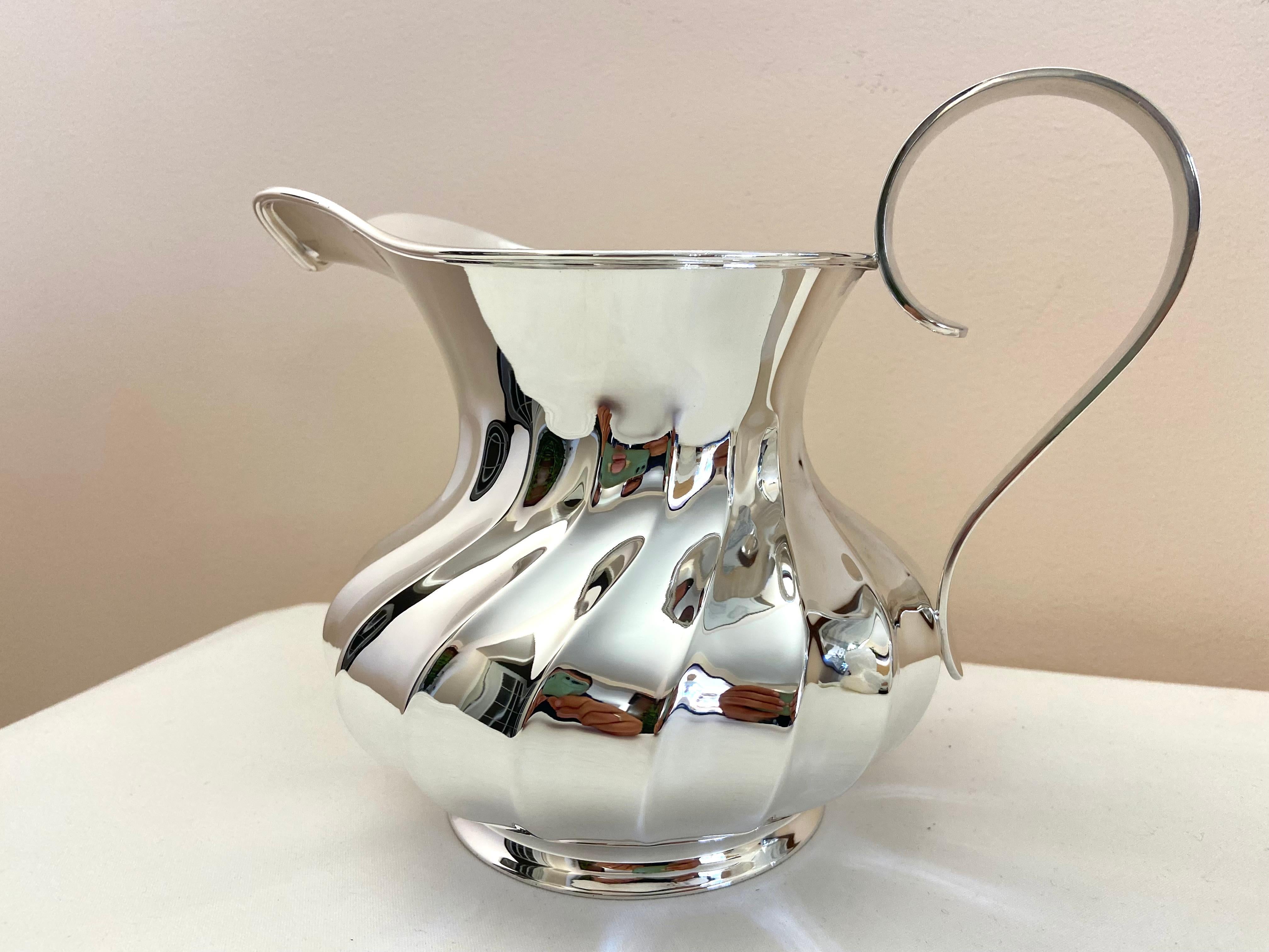 800 Silver Pitcher, new item from my jewelry. Zaramella, silversmith in Padua (Italy);19 cm high and 22 cm wide; It weighs 625 grams. Silver title 800 thousandths. Regularly stamped with state marks.