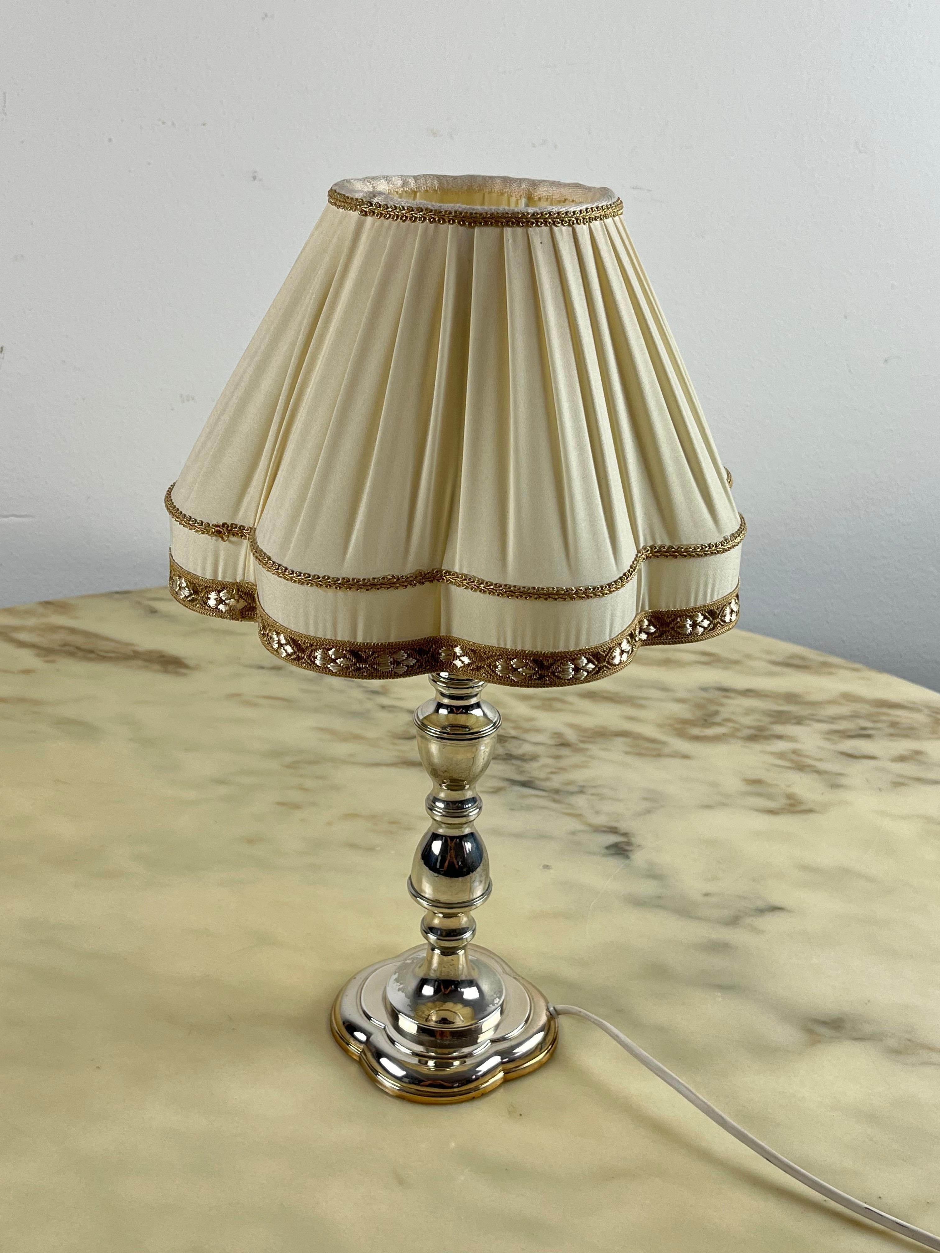 Modern 800 Silver Table lamp, Italy, 1980
Found in a noble apartment, it is intact and functional. Small signs of ageing. Regularly stamped with state marks.

We guarantee adequate packaging and will ship via DHL, insuring the contents against any