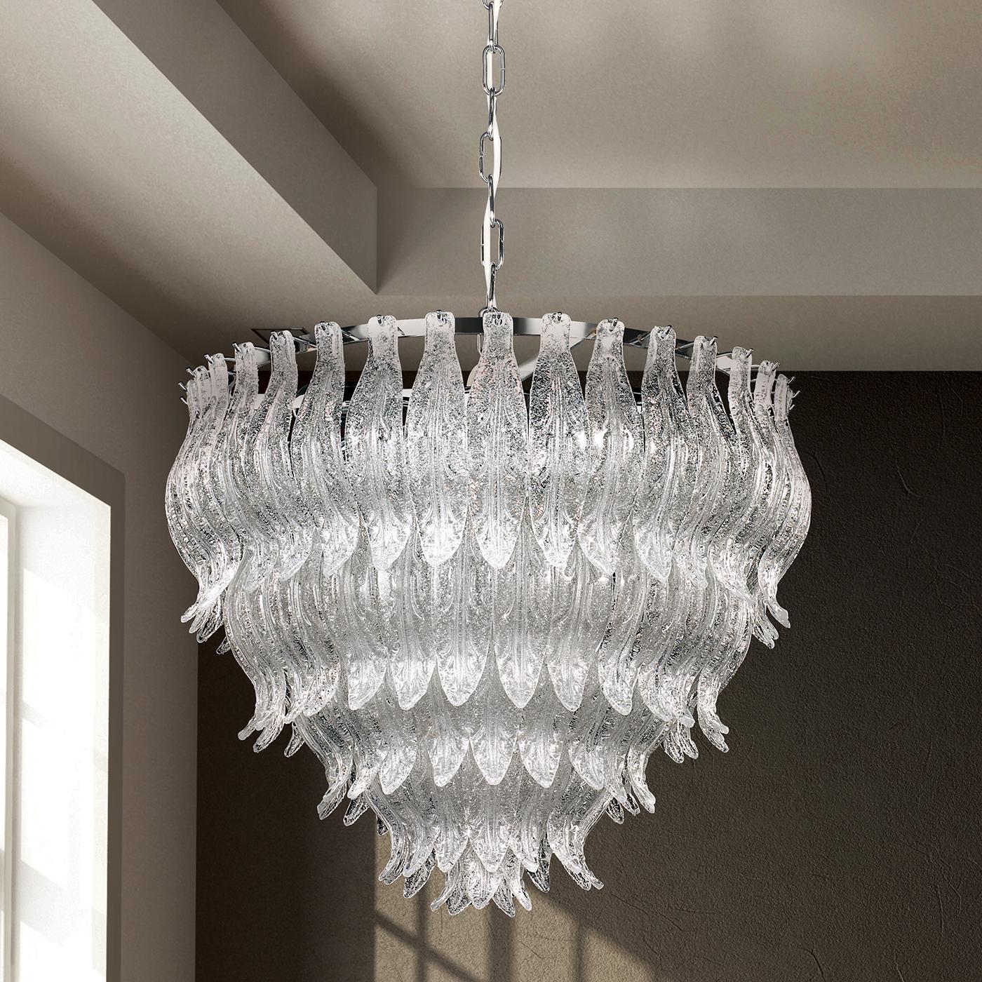 A dazzling design is the characterizing feature of this spectacular crystal chandelier. This fabulous lighting fixture boasts a cascade of decorative crystals in layered circular rows and also features detail in polished 24-karat gold or chrome. At
