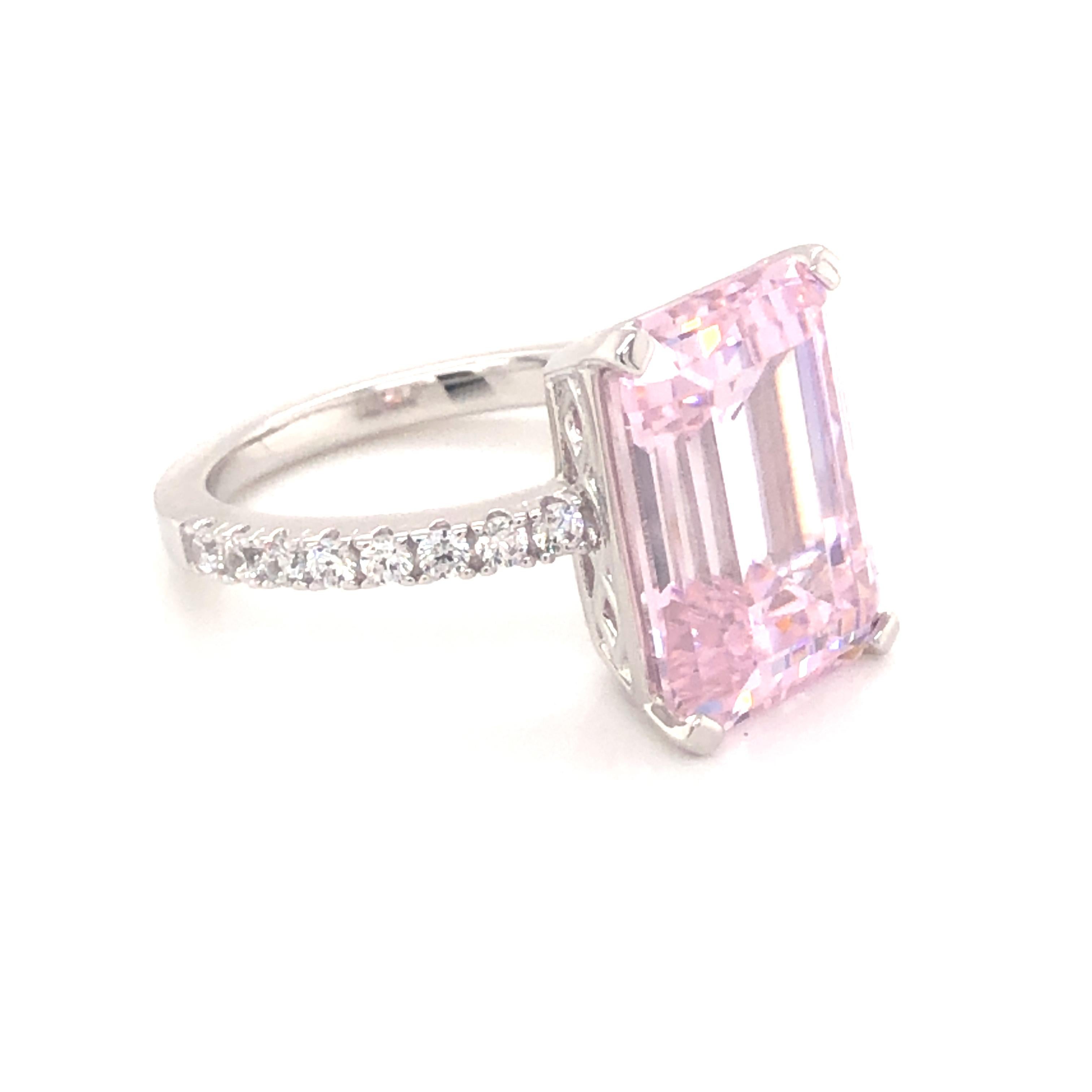 Striking pink hues radiate from this stunning statement piece. 

Featuring a large 8.00ct pale pink spinel emerald cut, with 0.32ct of round brilliant cuts on the shoulders, set in platinum on 925 sterling silver.
Other sizes available. 

Whether