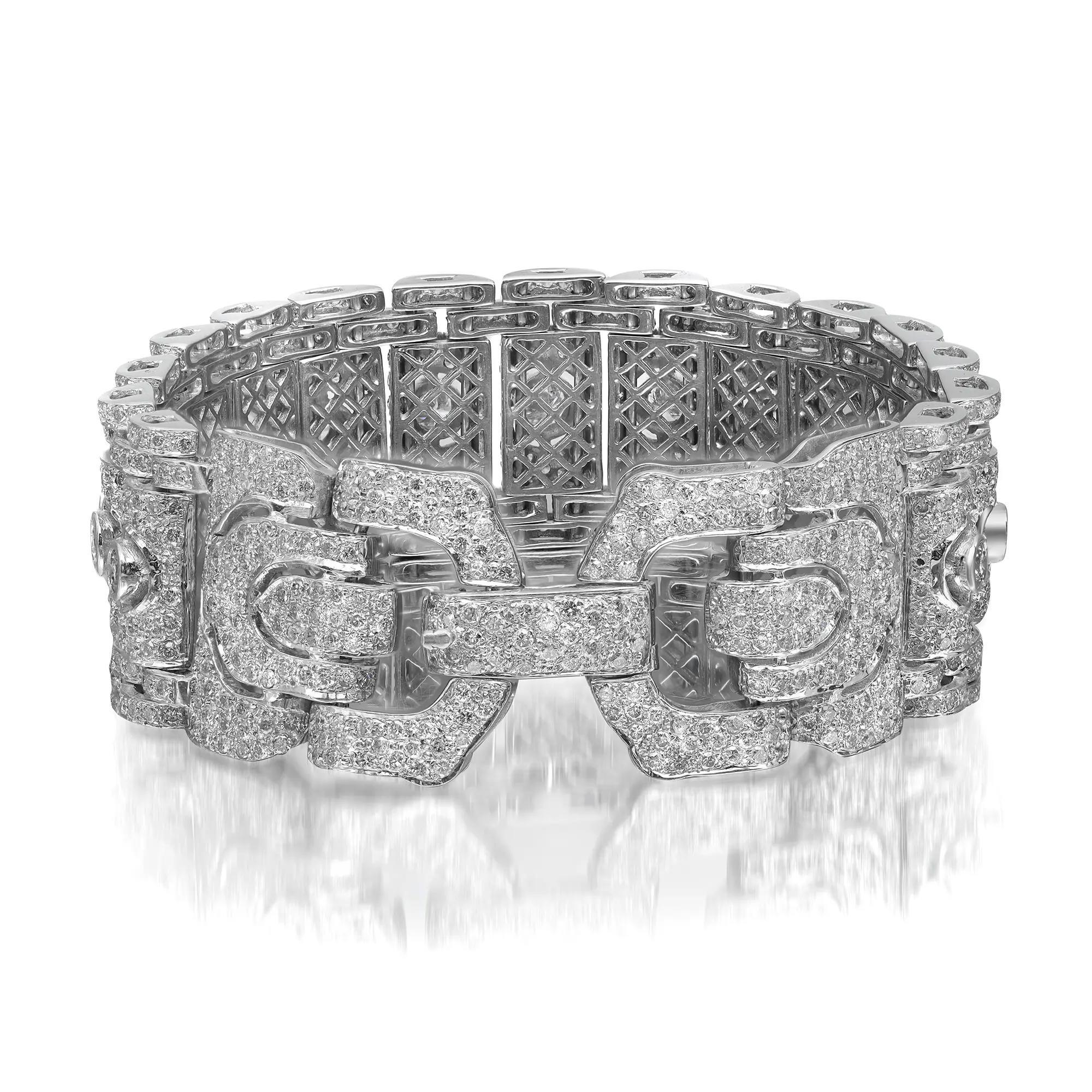 Beautiful and dazzling, this antique diamond bracelet is surely a stunner. Crafted in 18K white gold. This bracelet features 15 round brilliant cut diamonds in the center in a bezel setting with small diamonds set all over the bracelet in pave