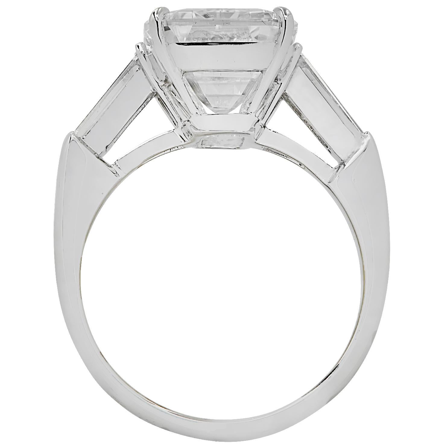 2 carat emerald cut diamond ring on hand