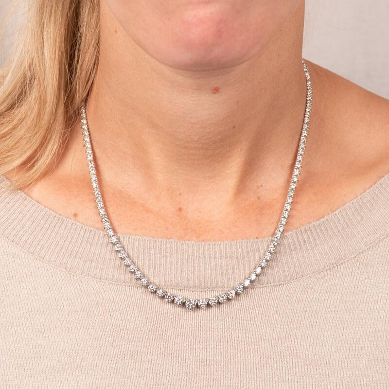 This gorgeous necklace features a total weight of 8.01 carats of graduated round brilliant cut diamonds set in 14 karat white gold. Box with safety clasp closure. The length is approximately 17