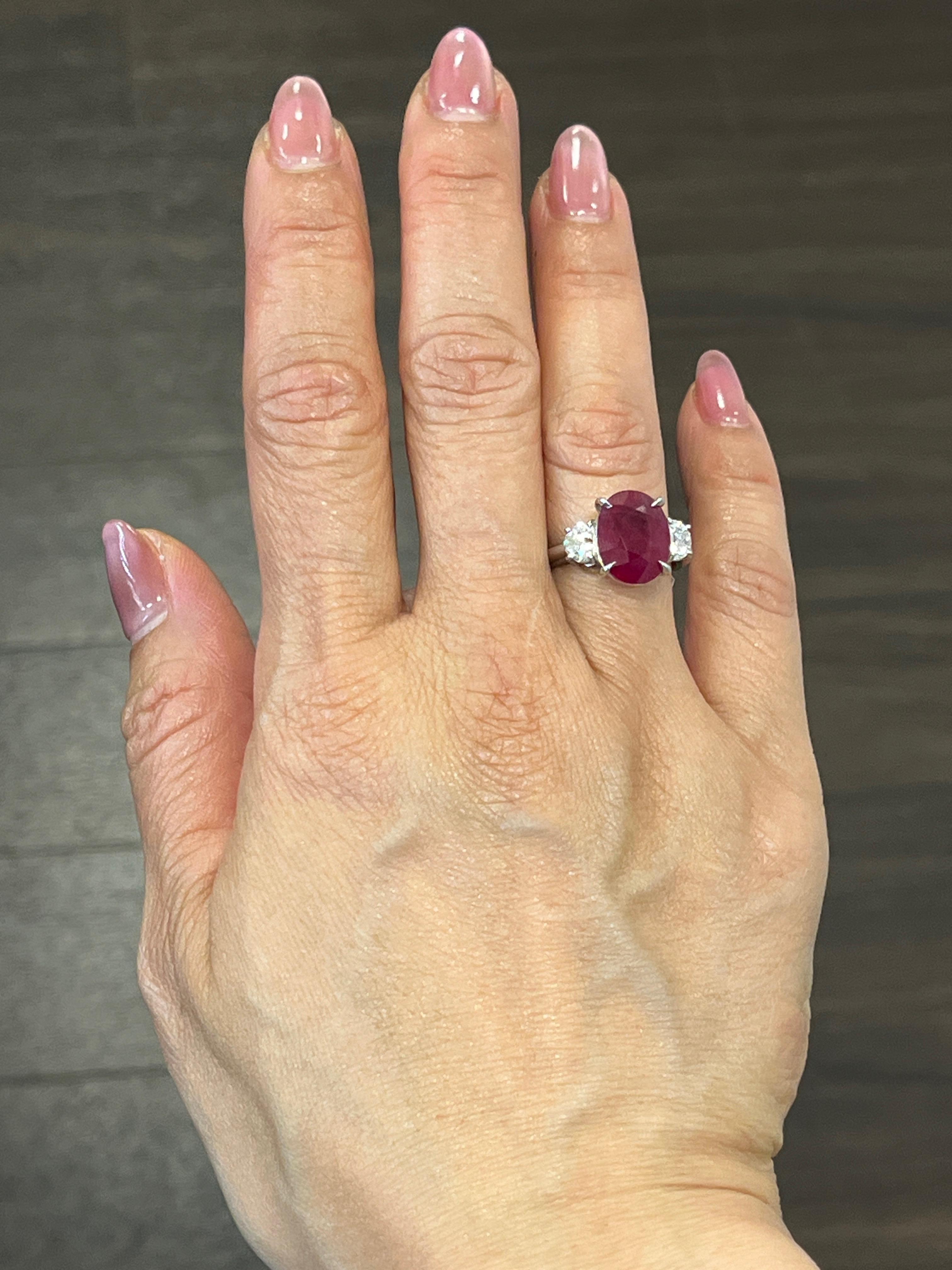 This gorgeous certified natural Burma ruby and diamond ring is sure to turn heads! A total carat weight of 8.01, this ring boasts 2 trapezoids adorning the sides of the natural Burma ruby. The diamonds are 0.95 ct and are G/H in color and VS2/SI1 in