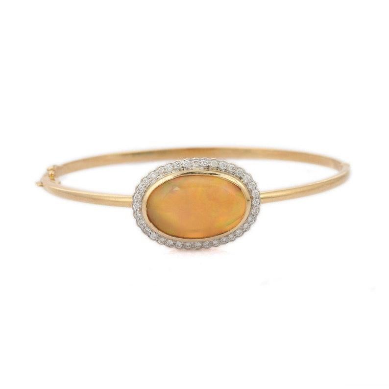 Ein wunderschönes, handgefertigtes Armband aus 14 Karat Gelbgold. Er ist von Hand mit 8,03 Karat Opal und 0,40 Karat funkelnden Diamanten besetzt. Tragen Sie ihn allein oder kombinieren Sie ihn mit Ihren Lieblingsteilen.

FOLLOW MEGHNA JEWELS