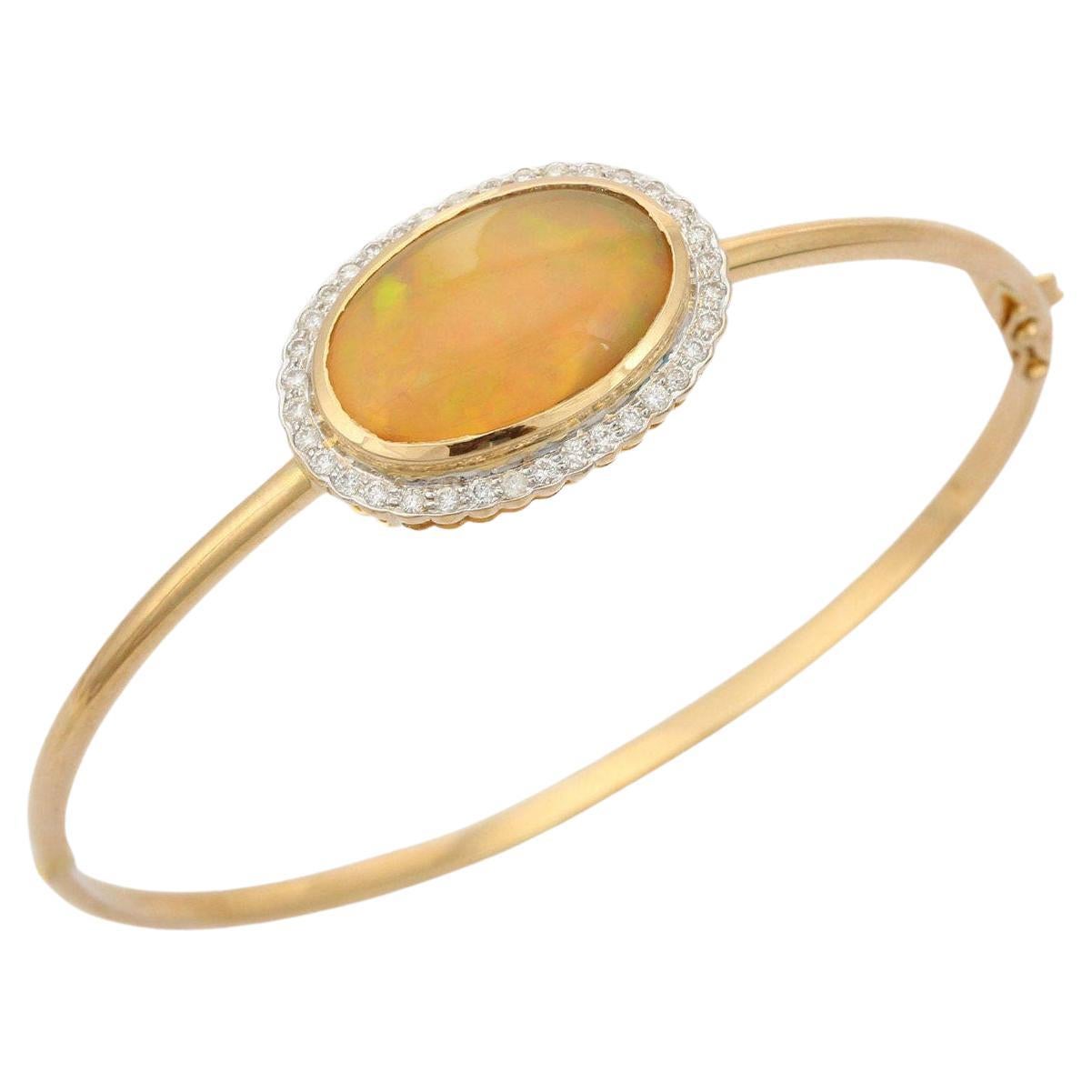 8.03 Carats Oval Opal Diamond 14 Karat Yellow Gold Bangle Bracelet For Sale