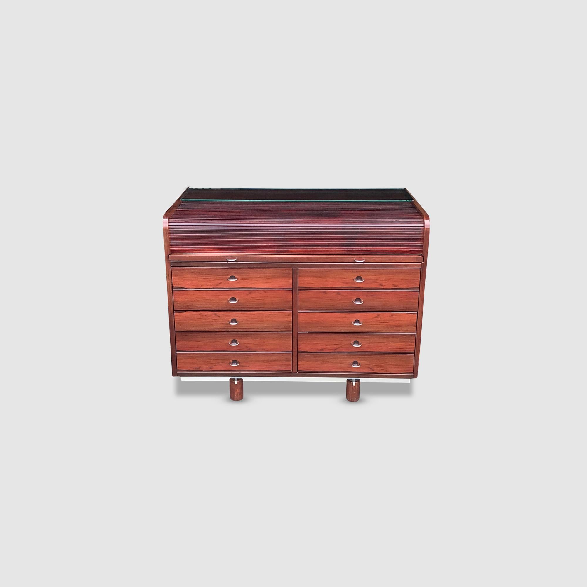 Rare roll-top desk model 804 designed by Gianfranco Frattini and manufactured by Bernini, Italy 1960s. The desk is made of rosewood veneer and has a remarkable design.

The piece can be used as a desk, and as a small cabinet at the same time.

The