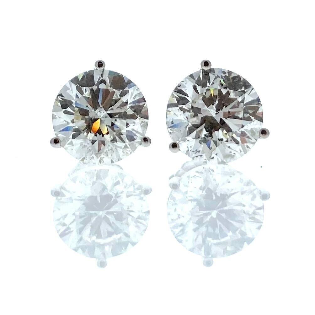 Introducing the pinnacle of elegance and luxury, these 8.04 Total Carat Weight EGL Certified Round Diamond Studs in 14k White Gold are the epitome of sophistication. Each stud showcases a mesmerizing round diamond with a captivating H-G color grade,