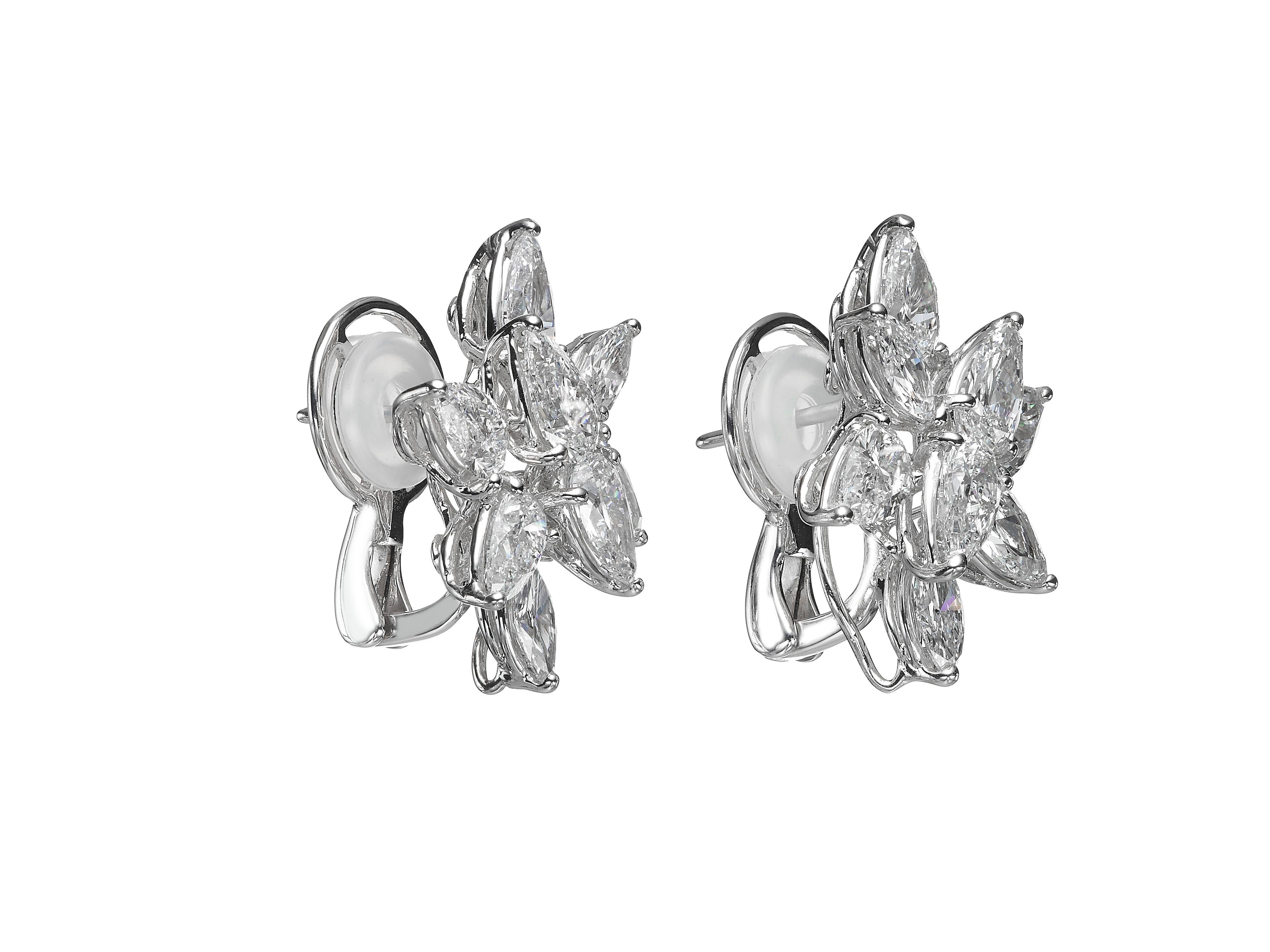 Butani's diamond stud earrings are set with a brilliant cluster of pear-shaped and marquise diamonds at varying angles, allowing the diamonds to capture light from every direction.  The earrings feature 12 pear-shaped diamonds weighing a total of