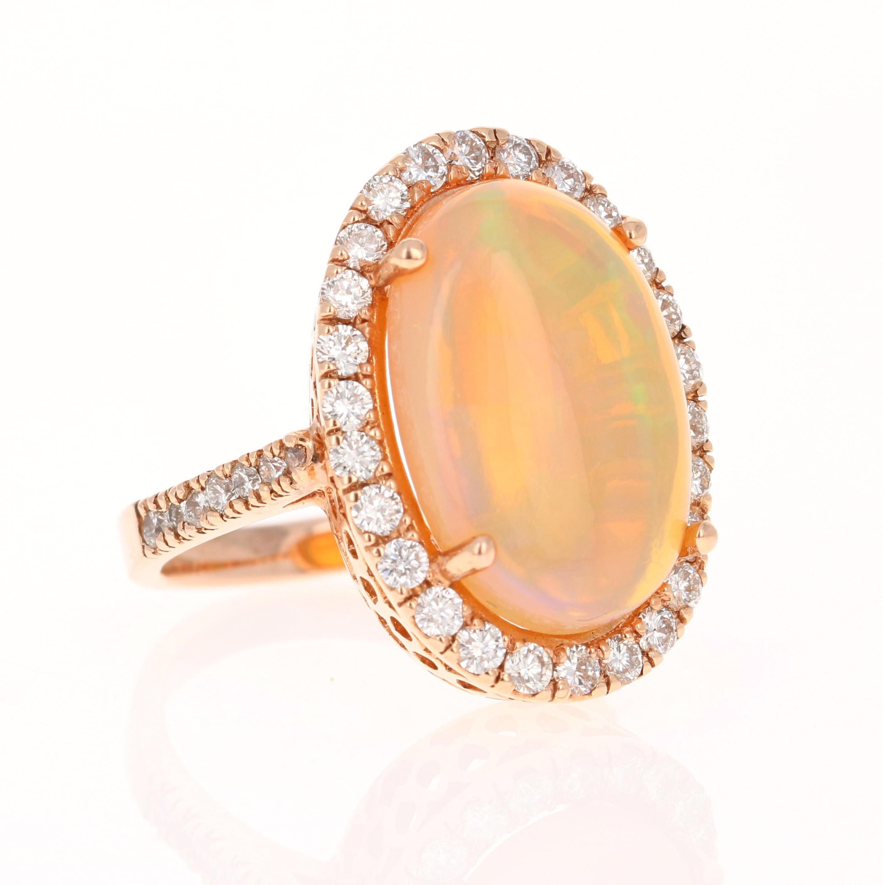 This ring has a 6.92 Carat Opal that is curated in a unique 14 Karat Rose Gold setting. The setting is adorned with 40 Round Cut Diamonds that weigh 1.15 Carats. (Clarity: VS, Color: H) The total carat weight of the ring is 8.07 Carats.

The Opal