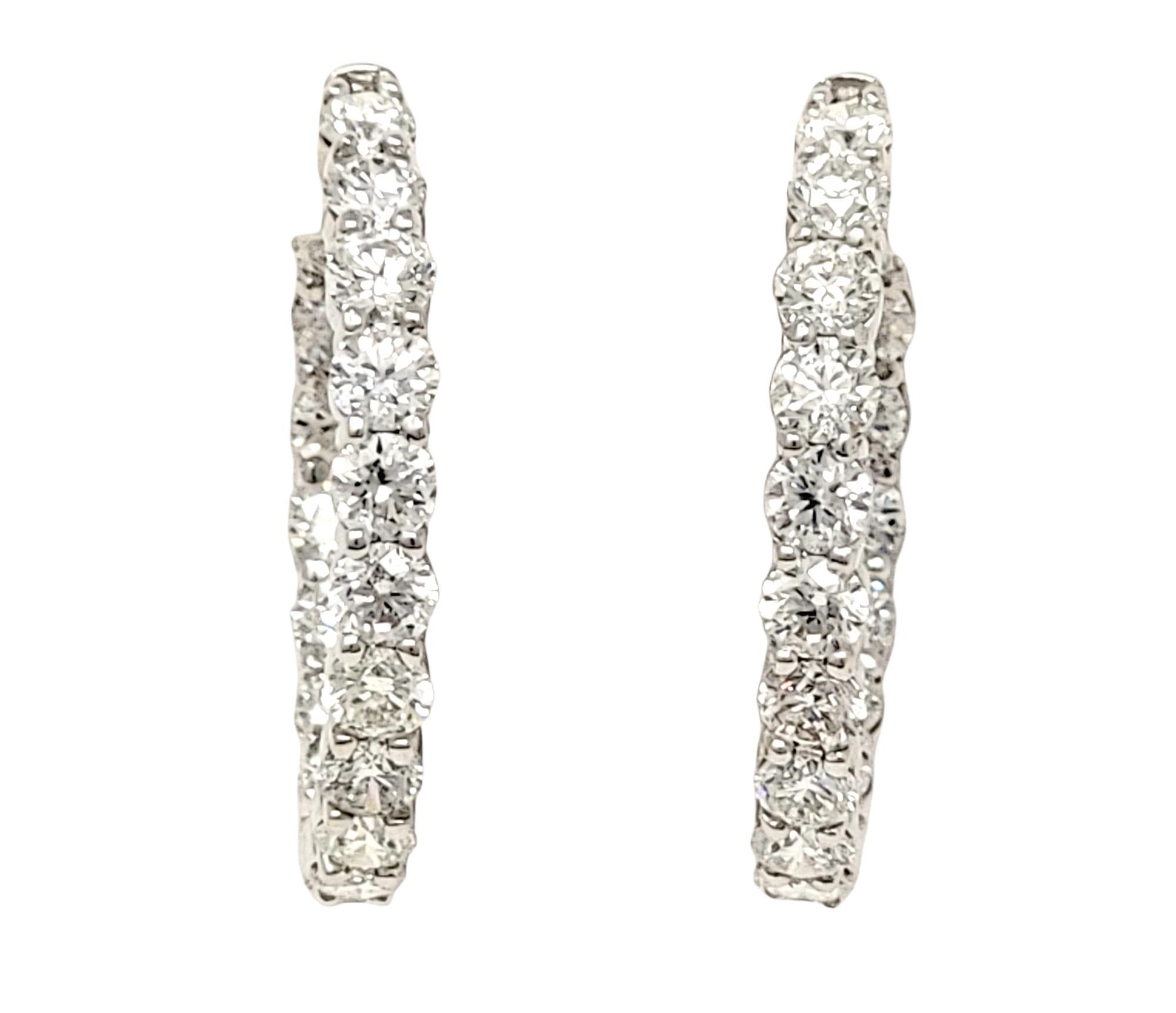 If you are looking for dazzling sparkle from every angle, these stunning diamond hoop earrings will not disappoint! Arranged in a unique inside/outside setting, the diamonds are positioned to catch the light from different angles, making your lobes