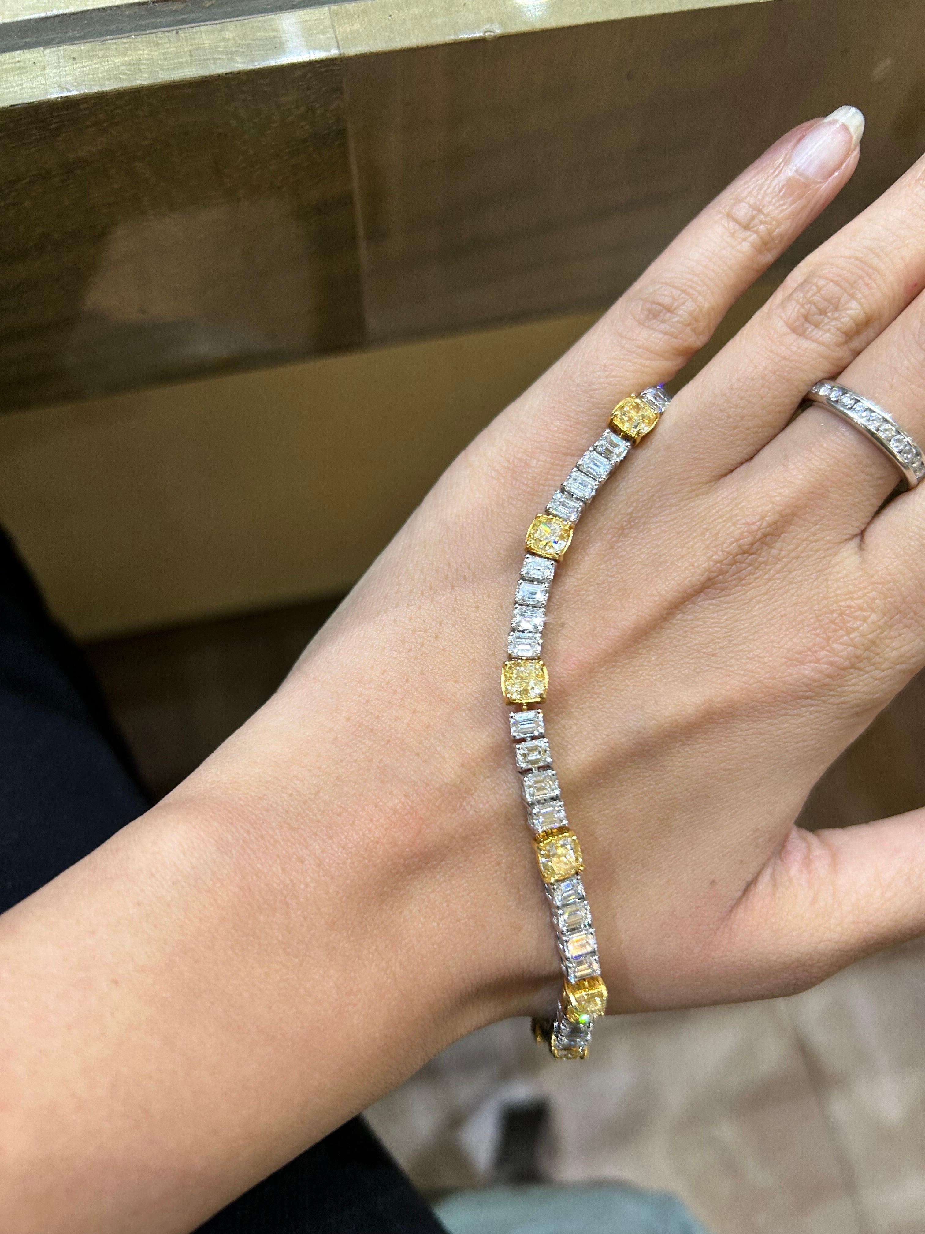A beautifully created 8.08 carat cushion cut Yellow Diamond weighing 1 carat each, and 7.85 carat emerald cut (weighing around 0.25 carats each) White Diamond bracelet set in 18K Gold. Currently 6.7 inches long. 