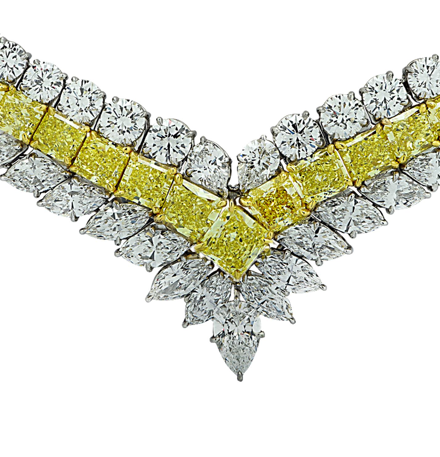 Sensational diamond necklace finely crafted in Platinum and 18 karat yellow gold, featuring Fancy Intense yellow diamonds and white diamonds weighing approximately 80.81 carats total. This exceptional necklace showcases 5 GIA Certified Fancy Intense