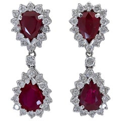 8.09 Carat Pear Shape Ruby and Diamond Halo Dangle Earrings