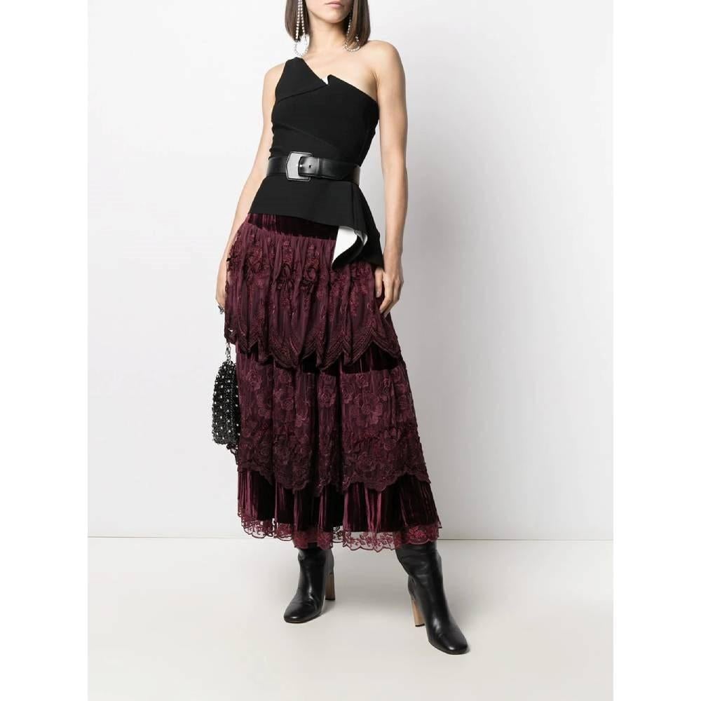 A.N.G.E.L.O. Vintage Cult burgundy cotton and viscose blend skirt. Elasticated waist, layered design and lace and velvet embroidery.

Size: 40 IT

Flat measurements
Height: 90 cm
Waist: 35 cm

Product code: A6138

Notes: The item shows some pulled
