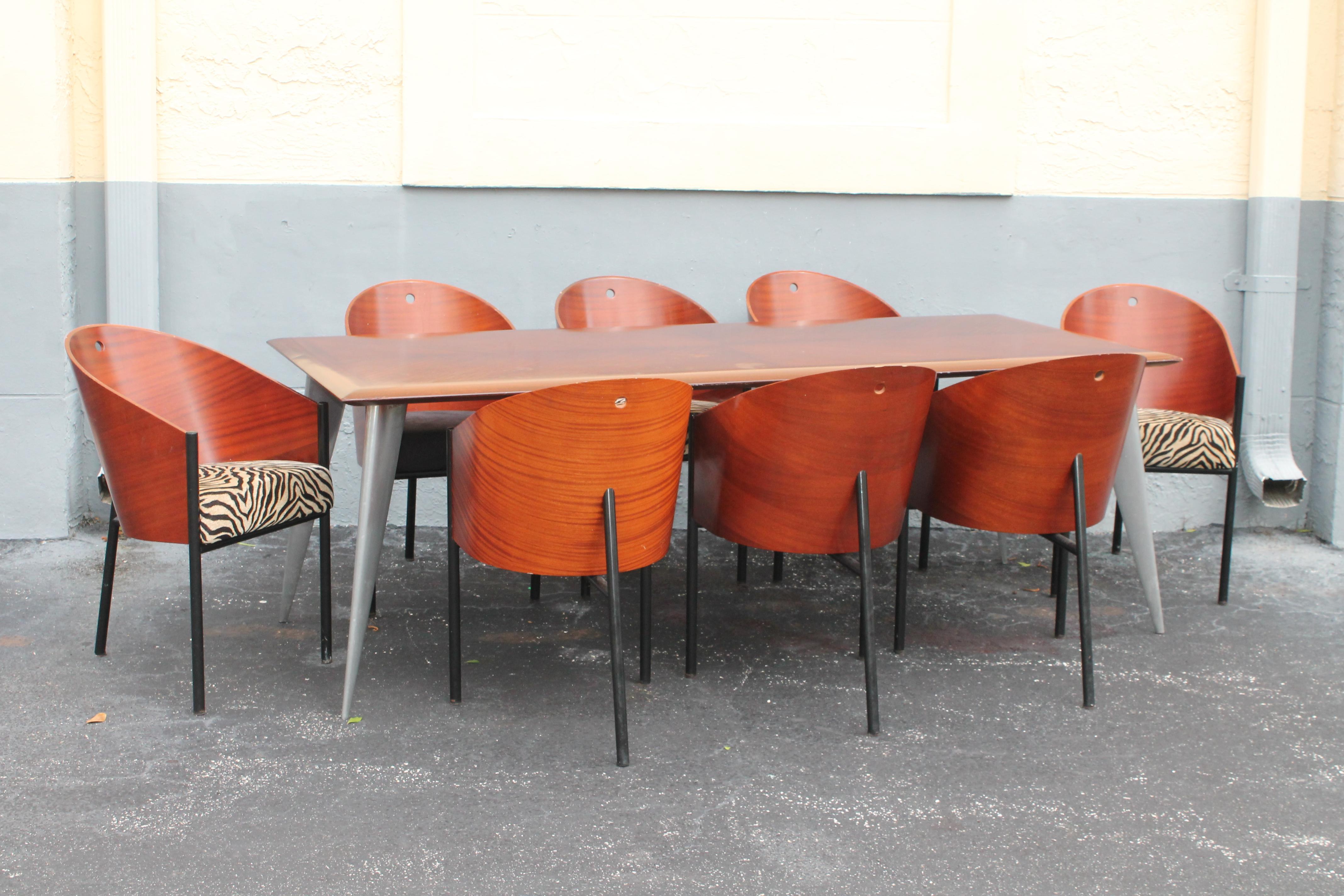 1980's Art Deco Inspired 9 Piece Dining Set Signed by the best! Philippe Starck. 8 chairs and one dining table included in this sale. I am going to let the pictures do the talking as they show exactly what this set is about. Dining table in