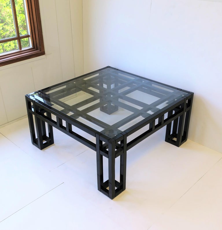 A very beautiful Postmodern European 1980s geometric square coffee or cocktail table in black lacquer with glass top, circa 1980s Europe. Glass top has beveled edge and is 'inset' into coffee table frame. A very chic table.

Table measures: 33.38