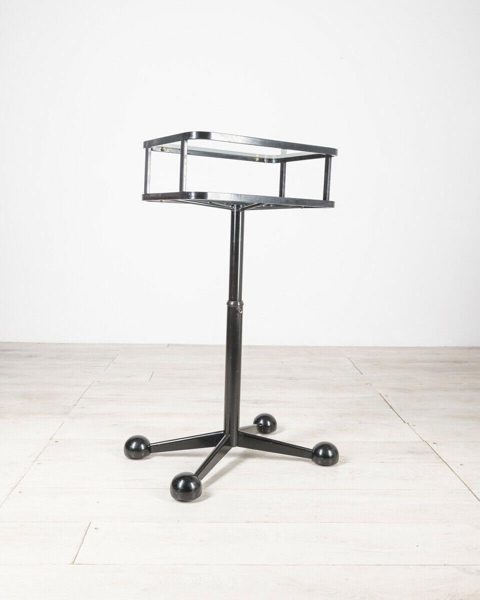 Coffee table with wheels in black metal with double glass top, design Allegri Arredamenti, 1980s.

CONDITIONS: In good condition, it may show slight signs of wear due to time.

DIMENSIONS: height 101 cm; width 57 cm; length 43 cm

MATERIALS: