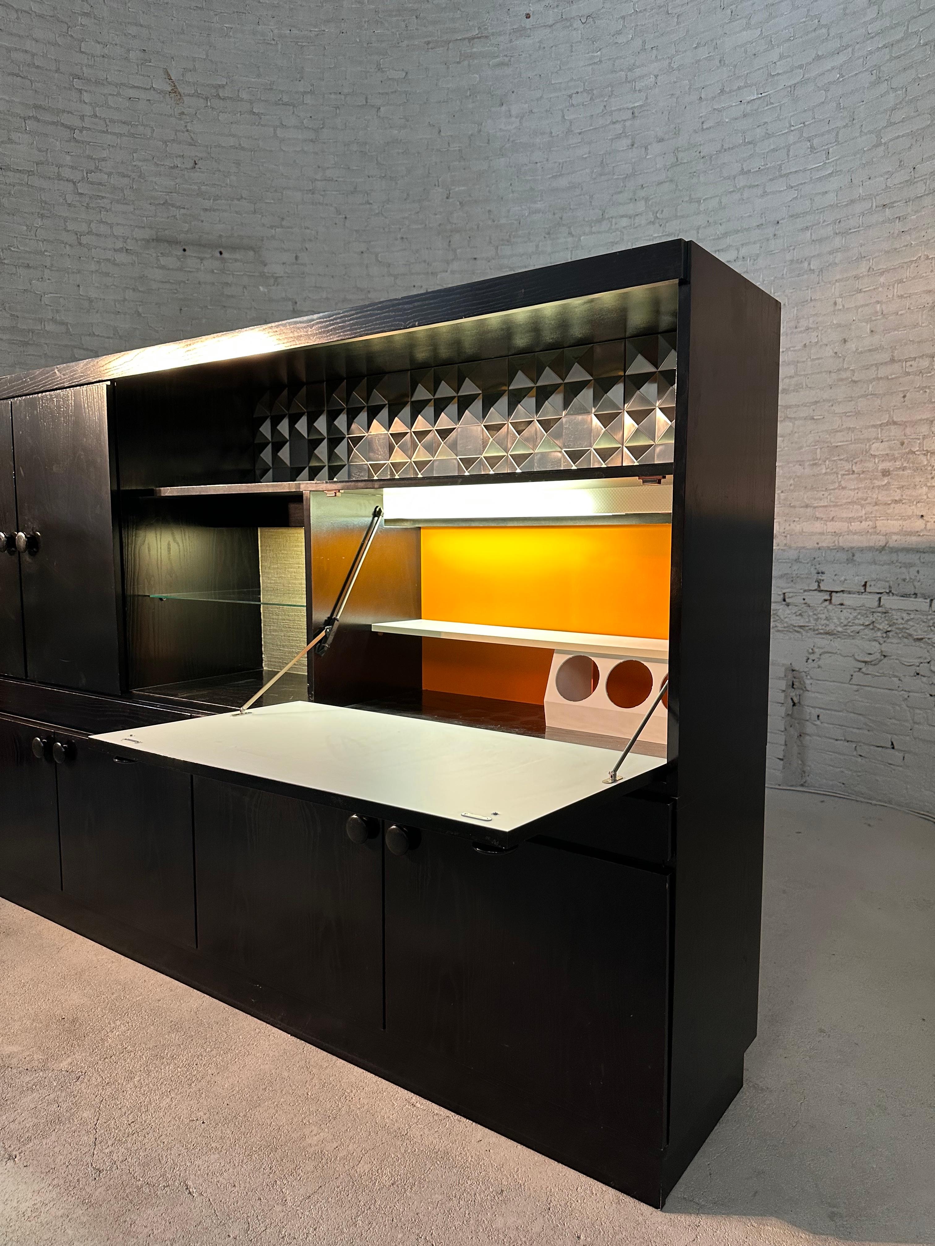 Make a statement with this XXL bar cabinet that looks like it time traveled straight out of the '80s! With four connecting drawers and plenty of space to store a liquor store.

This graphic cabinet made of black pinewood and aluminium is a fun and