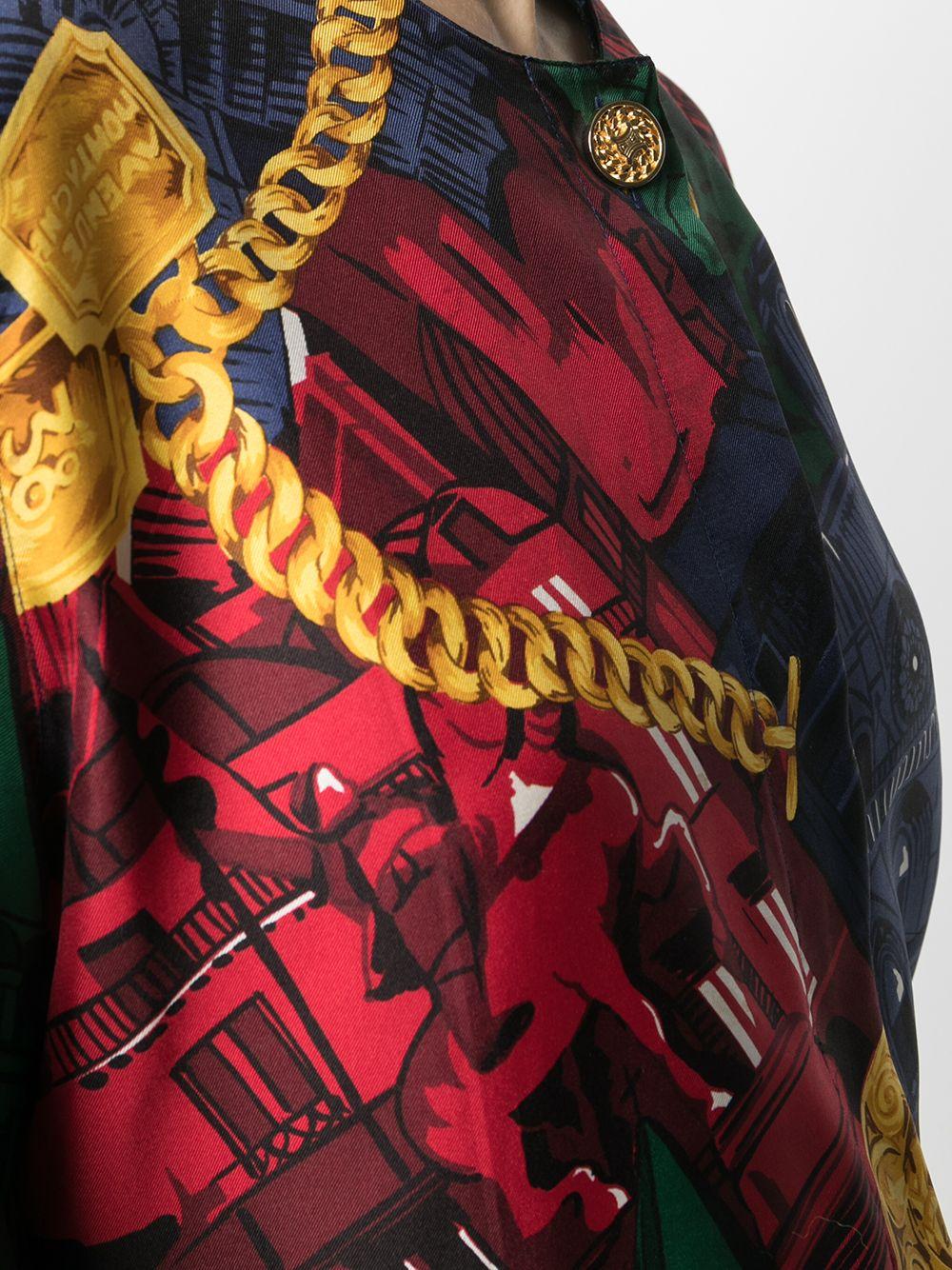 Stunning vintage silk shirt from Céline. Crafted from 100% silk, featuring long sleeves, logo engraved top button, and an all over print of Parisian monuments in striking primary colours.	

Colour: Multi	

Composition: 100% Silk	

Condition: Very