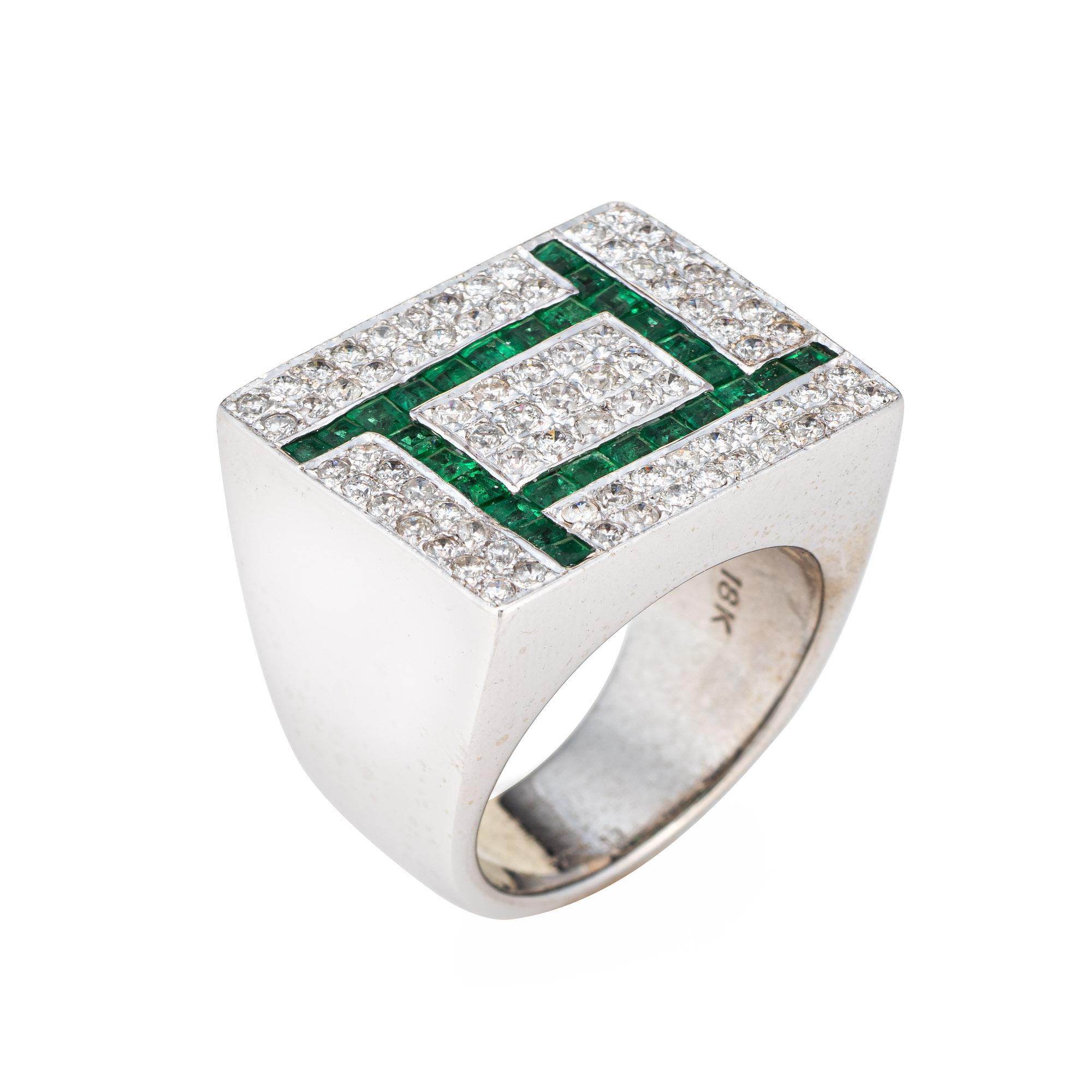 Stylish vintage diamond & emerald ring (circa 1980s) crafted in 18 karat white gold. 

79 round brilliant cut diamonds total an estimated 0.79 carats (estimated at I-J color and SI1-I2 clarity). Emeralds measure approx. 1.5mm each. 

Set in a