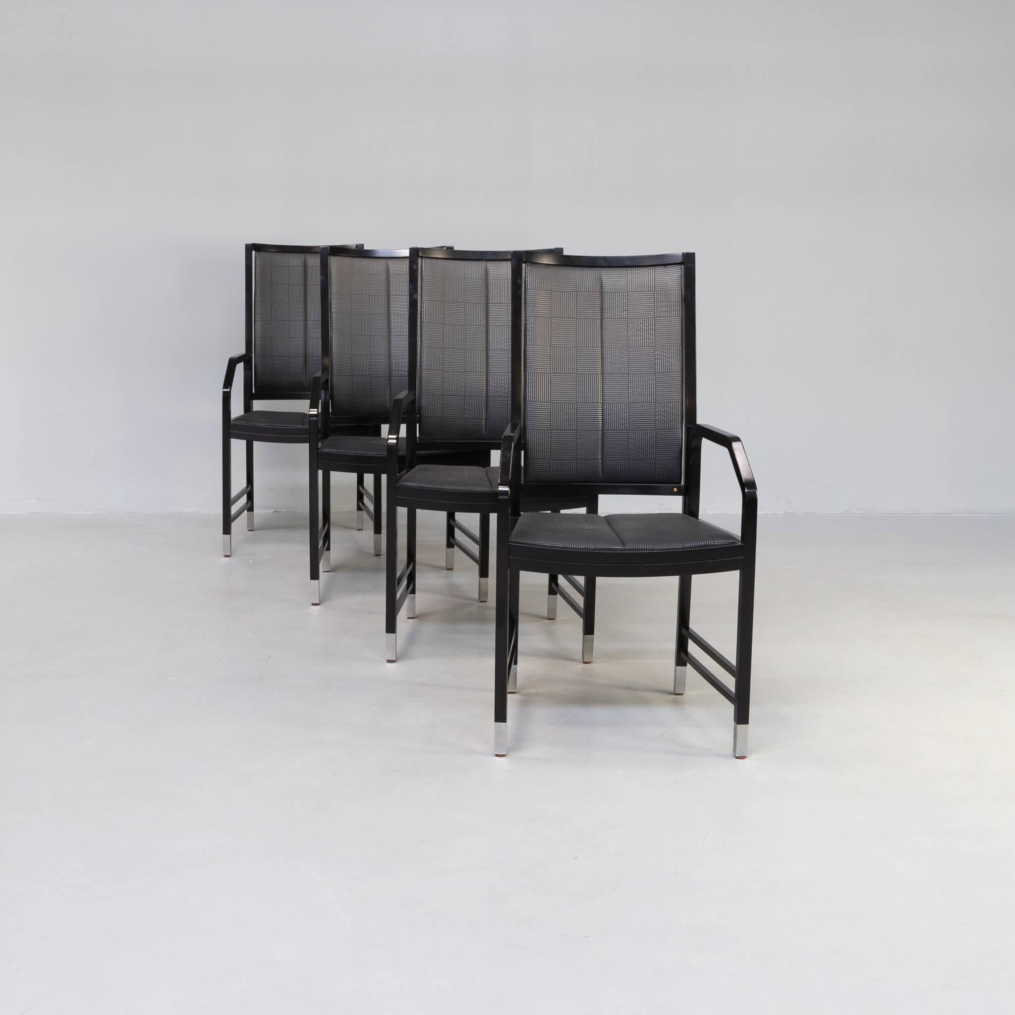 4 Black lacquered wooden dining chairs references to some great designer of the 19th and 20th Centuries: Michael Thonet, Josef Hoffman and Otto Wagner. This set of chairs was designed by Ernst W. Beranek in Germany in the 1980s as an homage to the