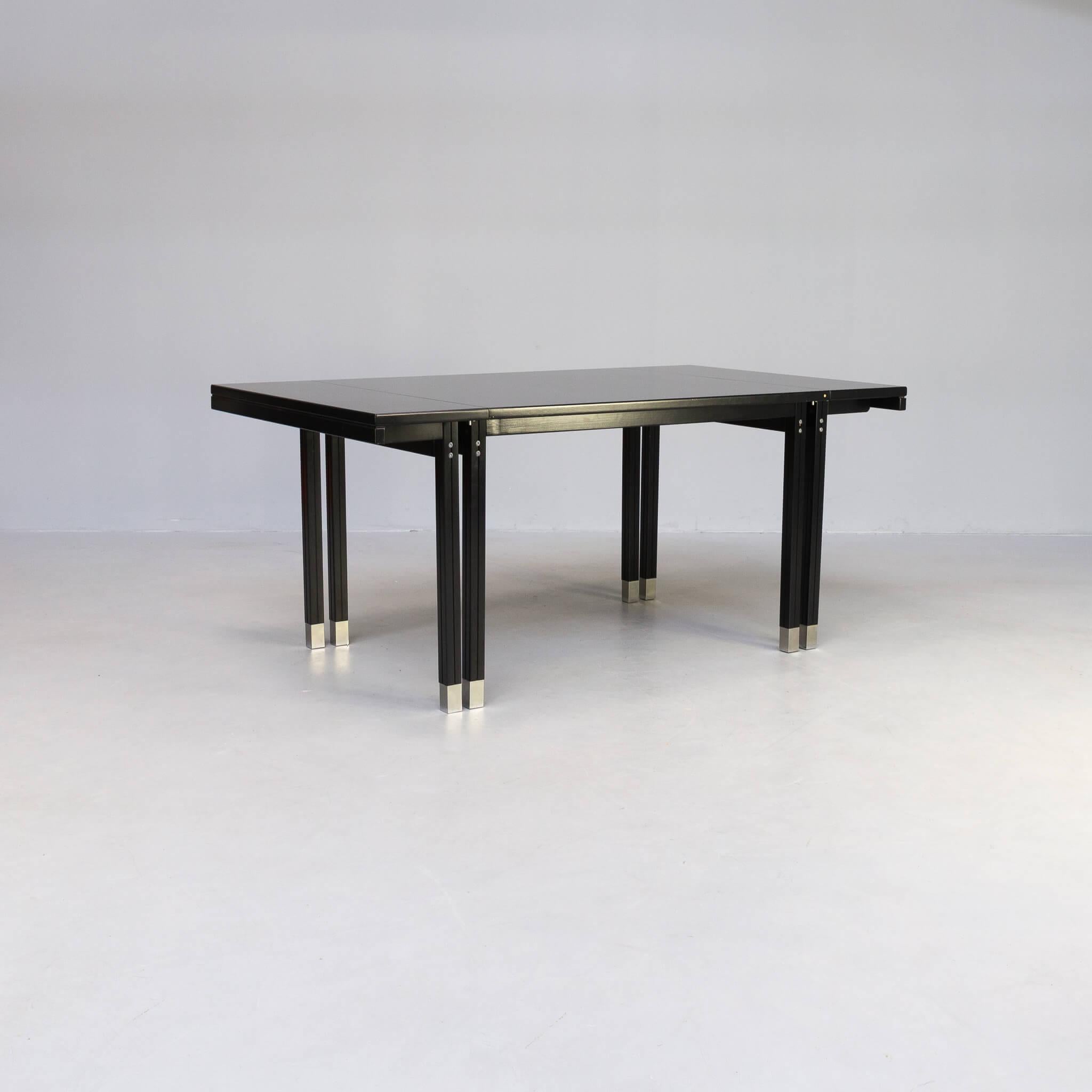 A black lacquered wooden dining table references to some great designer of the 19th and 20th Centuries: Michael Thonet, Josef Hoffman and Otto Wagner. This table was designed by Ernst W. Beranek in Germany in the 1980s as an homage to the work of